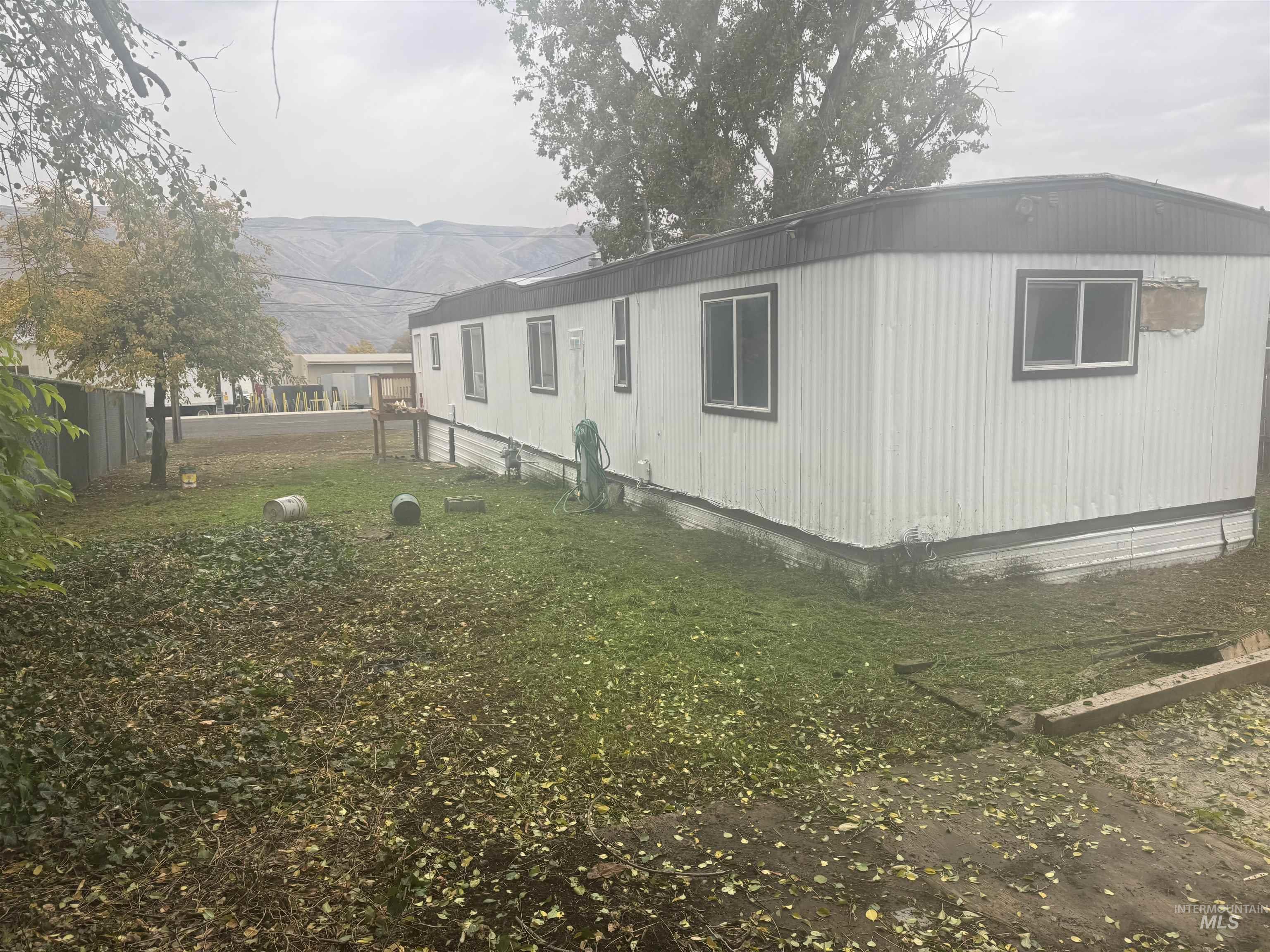 View of property exterior featuring a mountain view