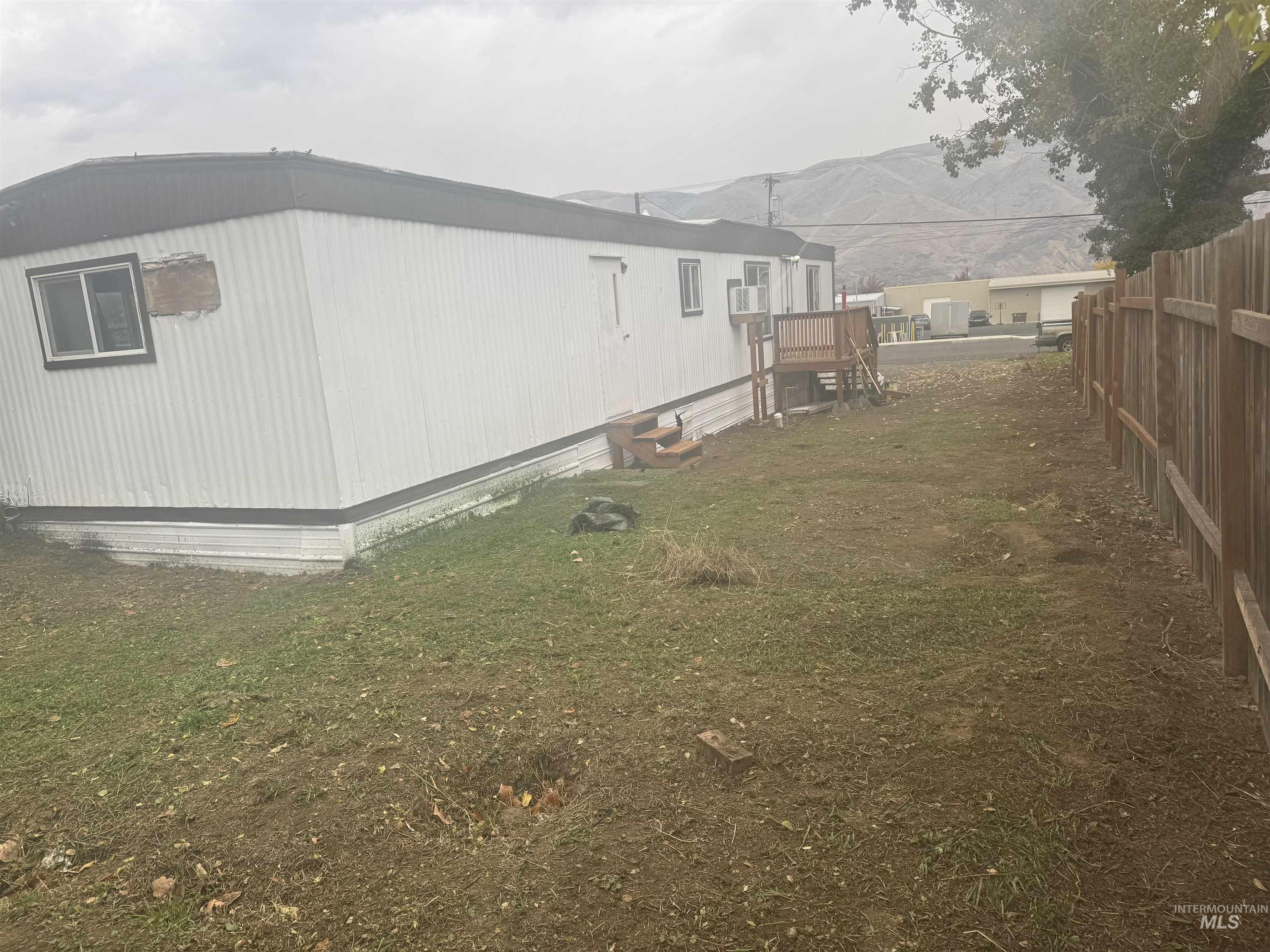View of side of property featuring a mountain view