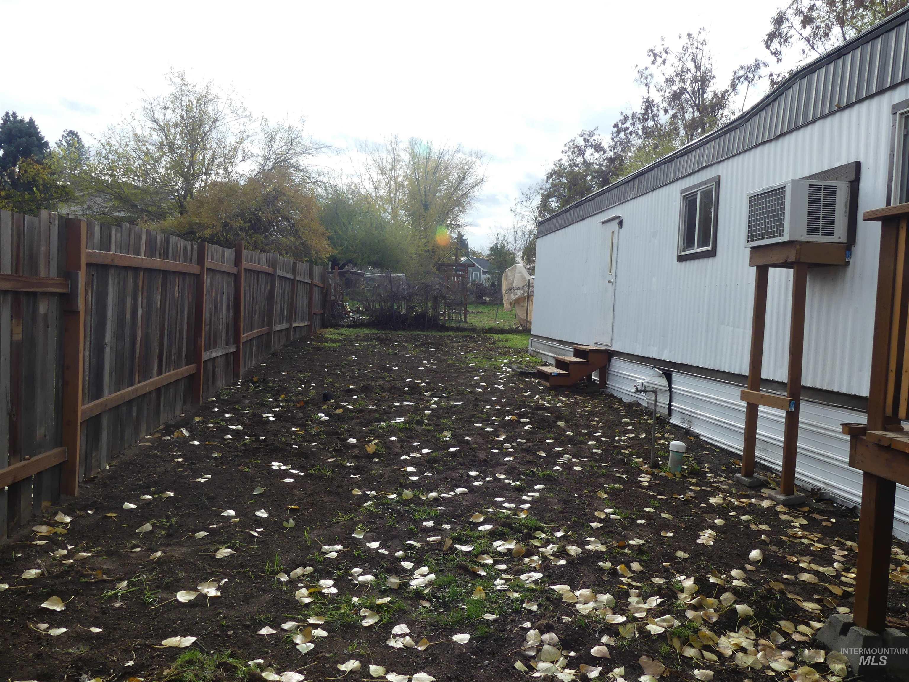 View of yard with entry steps
