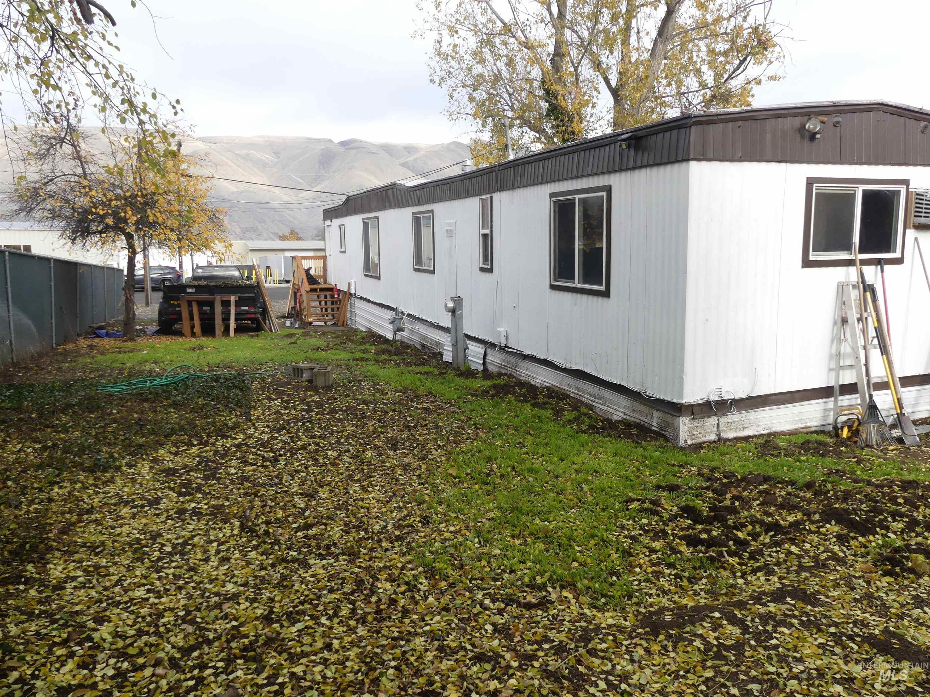 View of home's exterior featuring a fenced backyard and a mountain view
