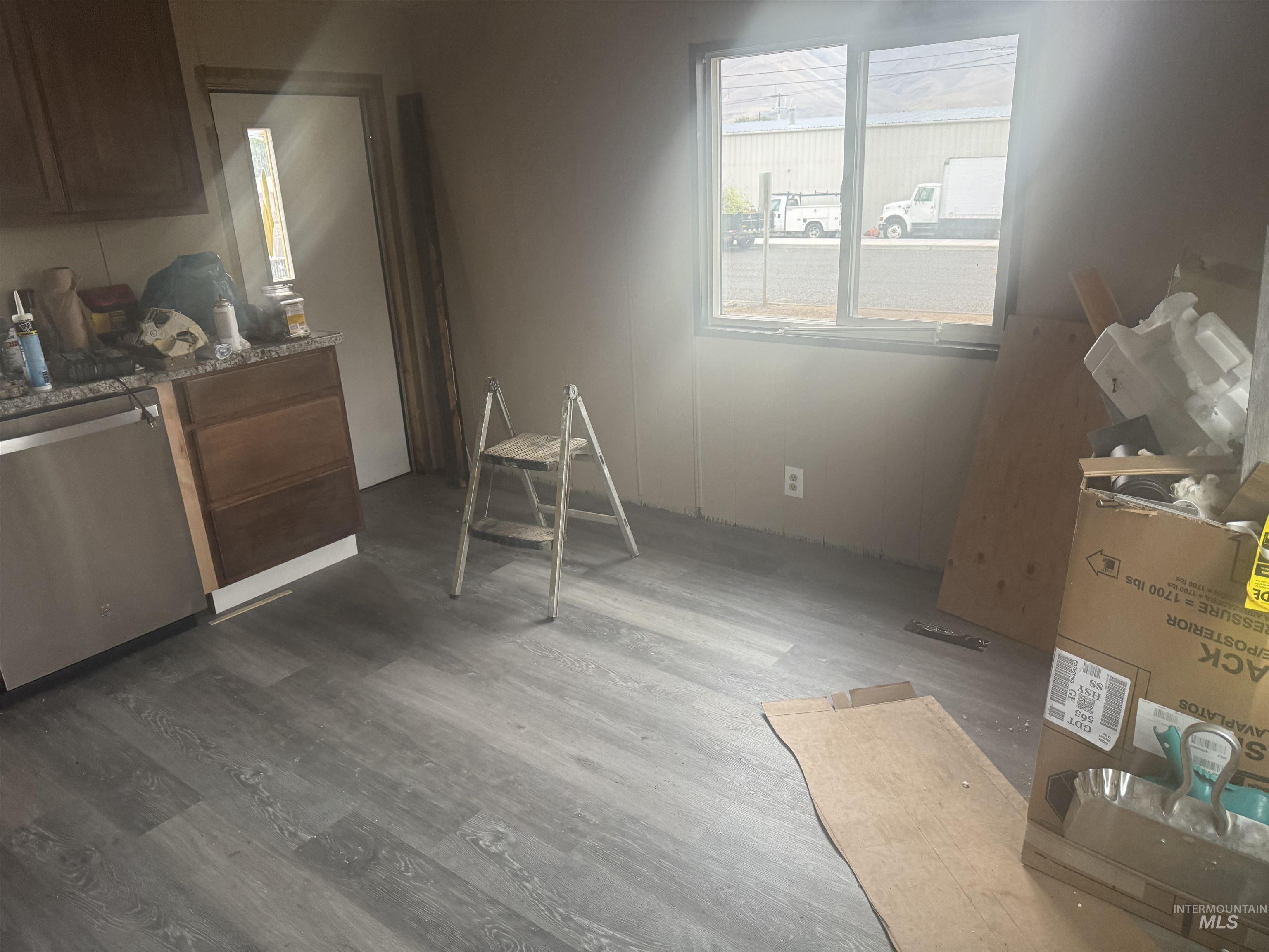 Dining area featuring dark wood-style floors
