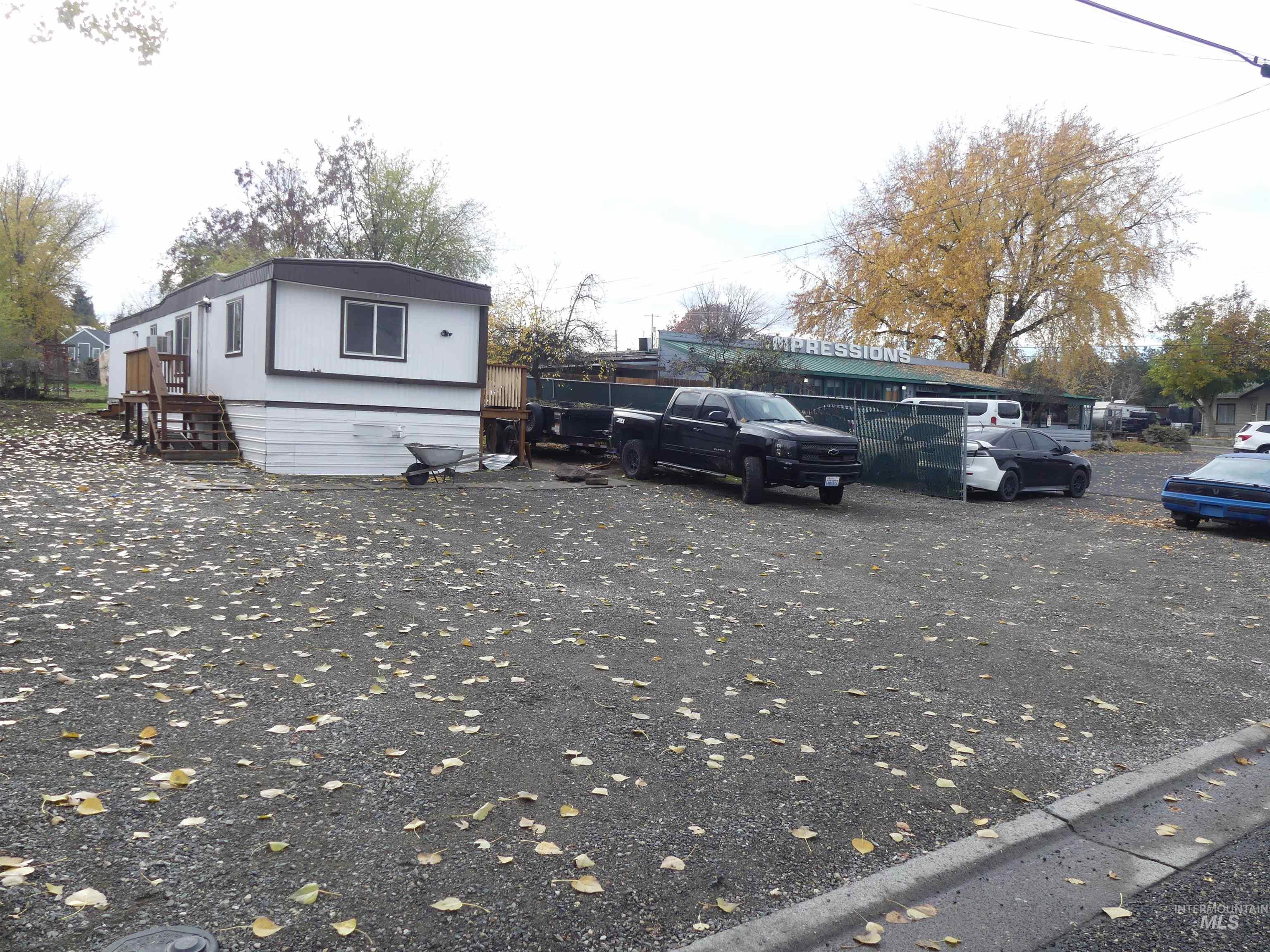 View of side of home with uncovered parking