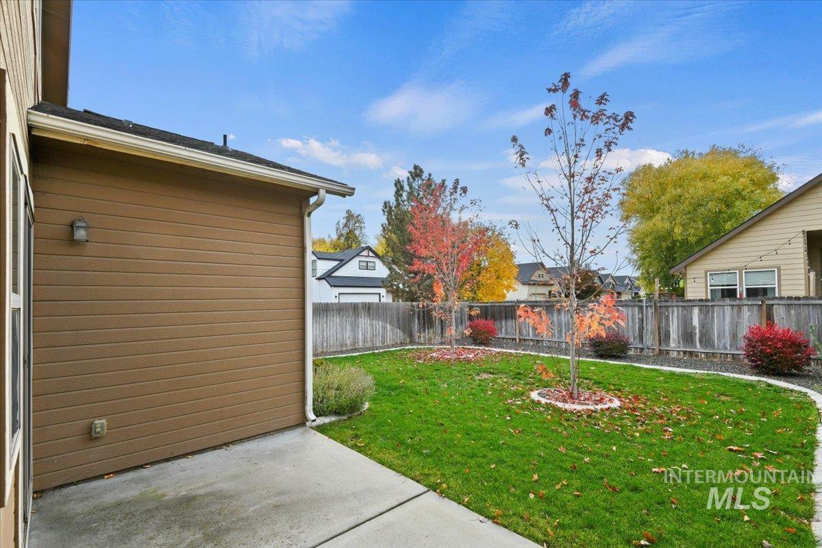 Fenced backyard featuring a patio