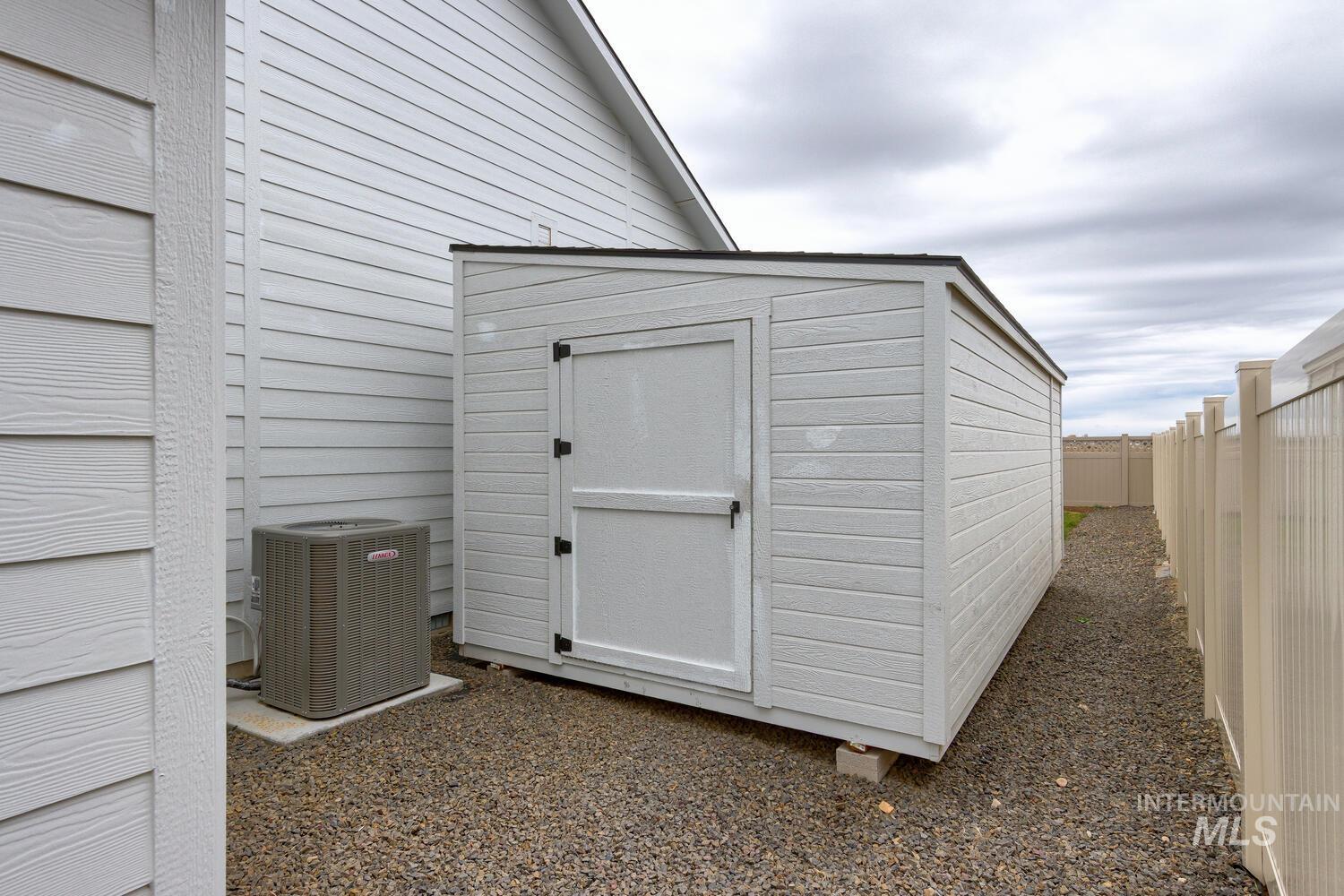 View of shed featuring a fenced backyard