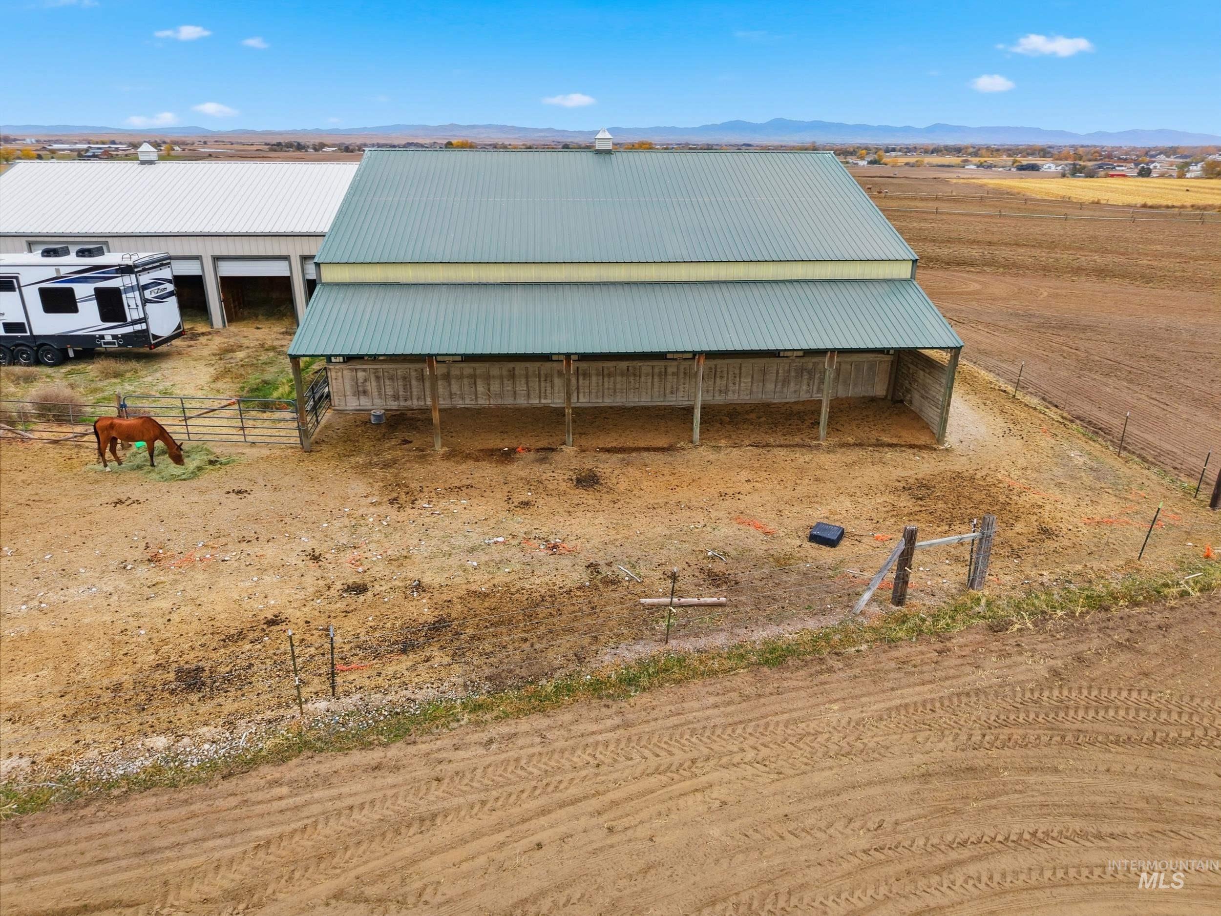 View of outdoor structure with a view of rural / pastoral area, a mountain view, and an exterior structure