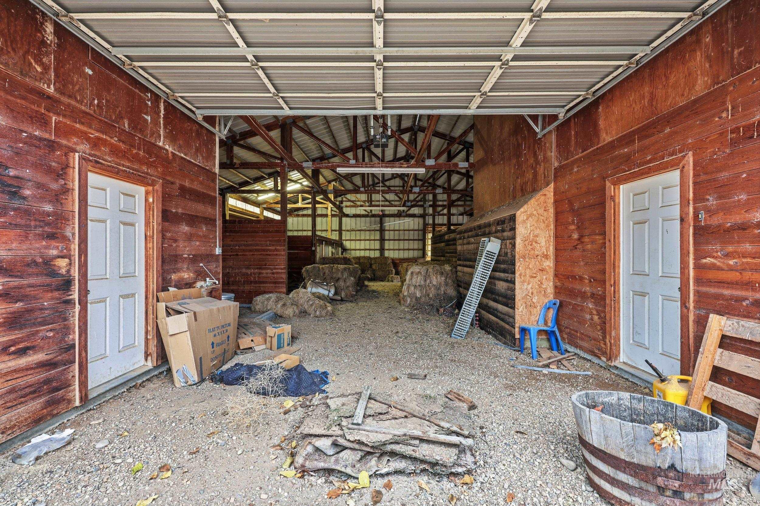 Garage featuring wooden walls
