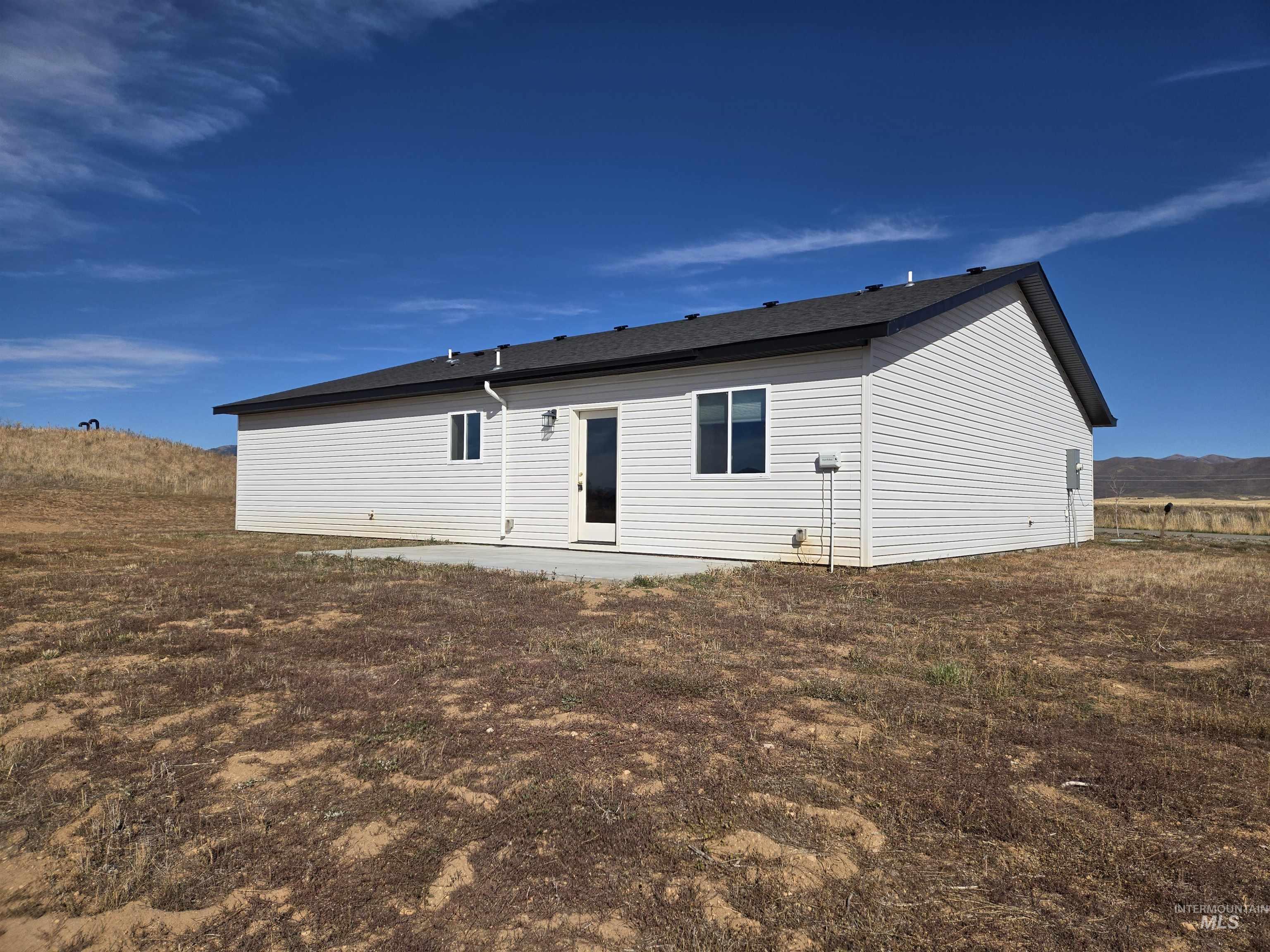 Back of property with a patio area