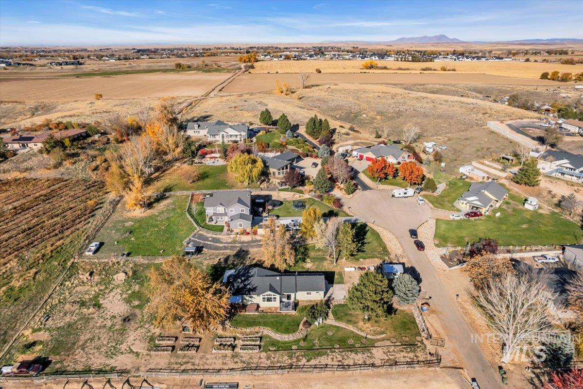 Aerial view of property and surrounding area featuring rural landscape