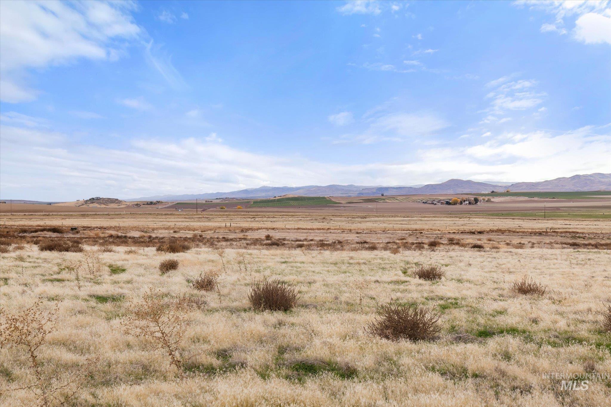 View of mountain background featuring rural landscape