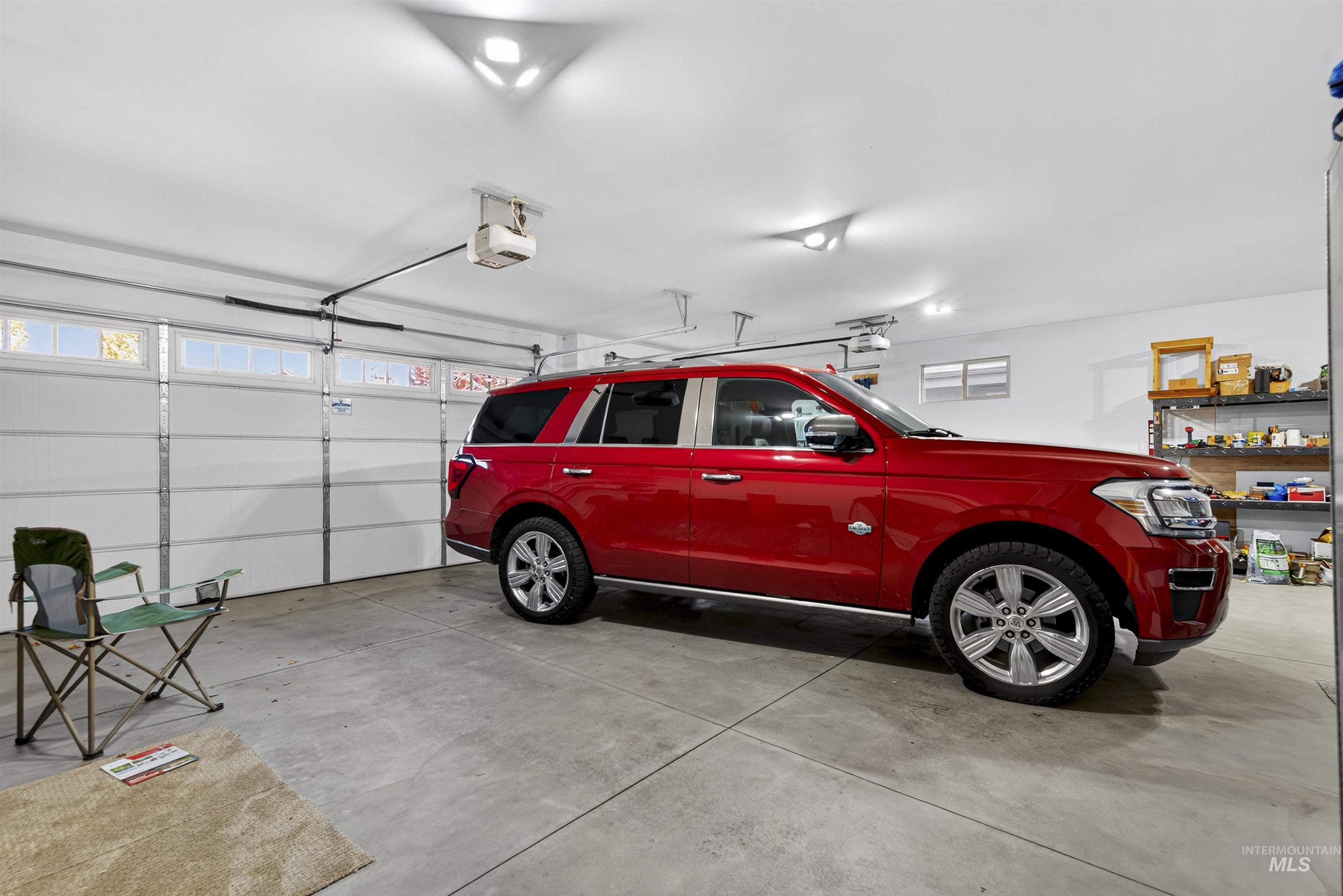 Garage featuring a garage door opener