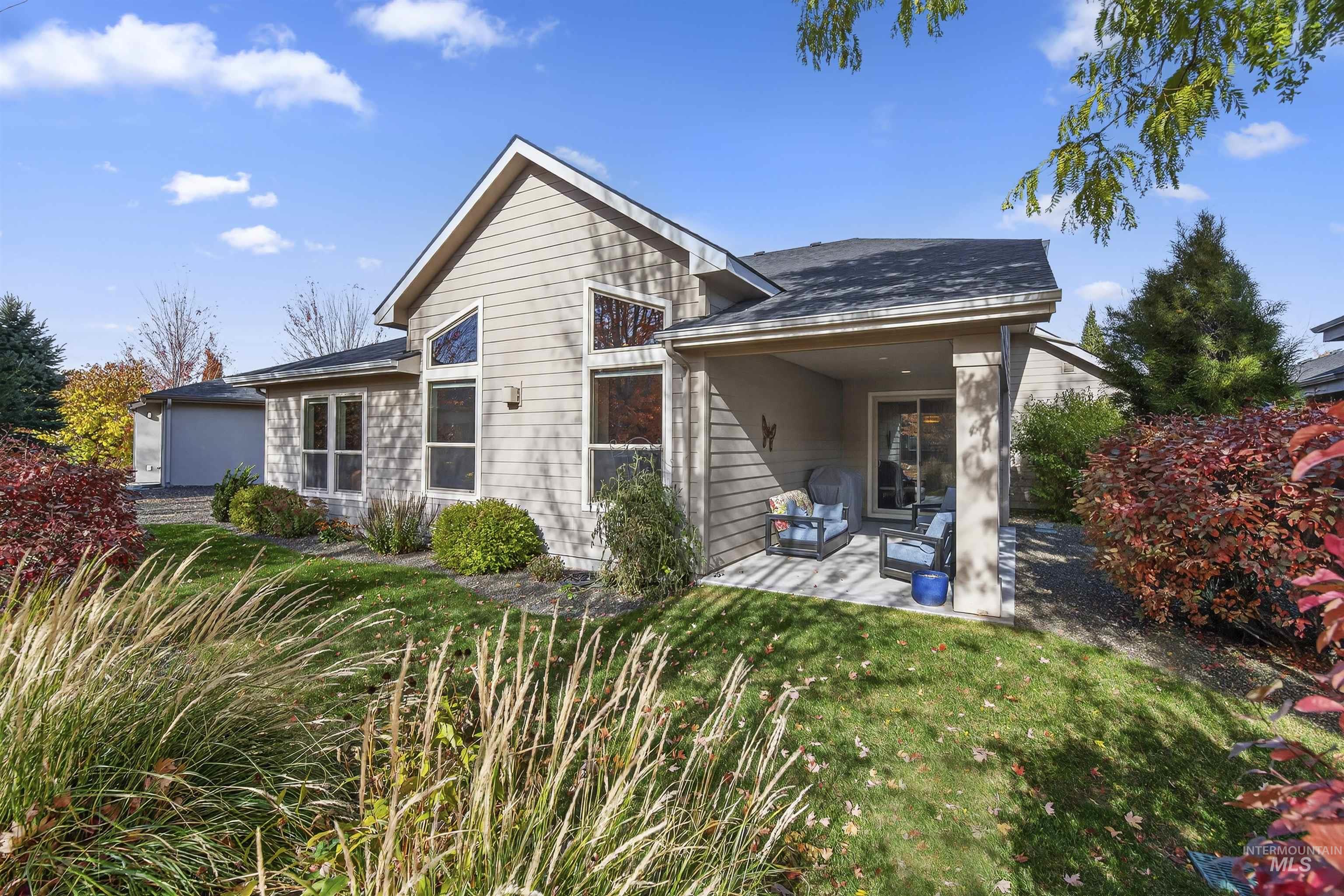 Back of property with a patio, a yard, and an outdoor hangout area