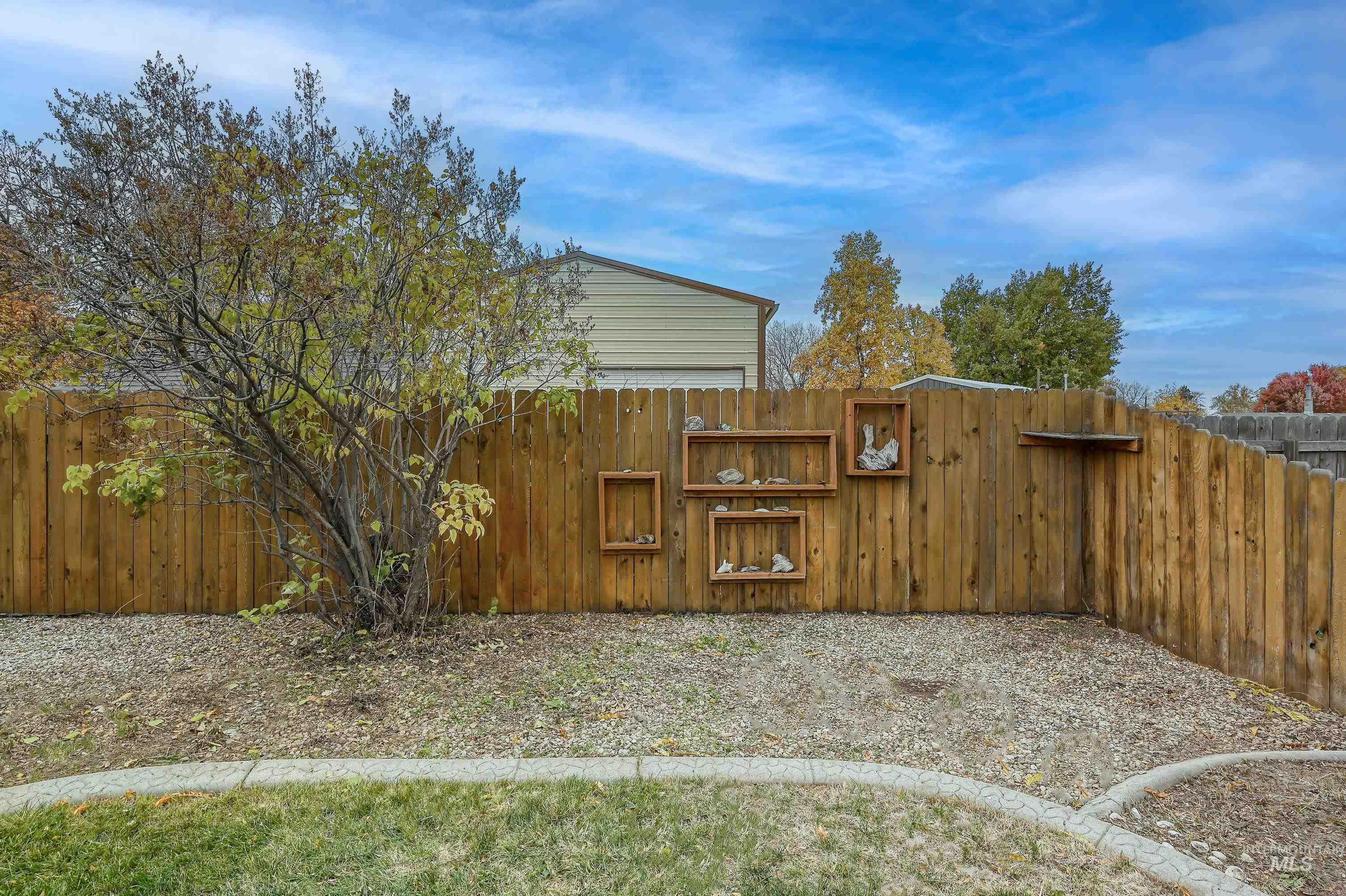 View of fenced backyard