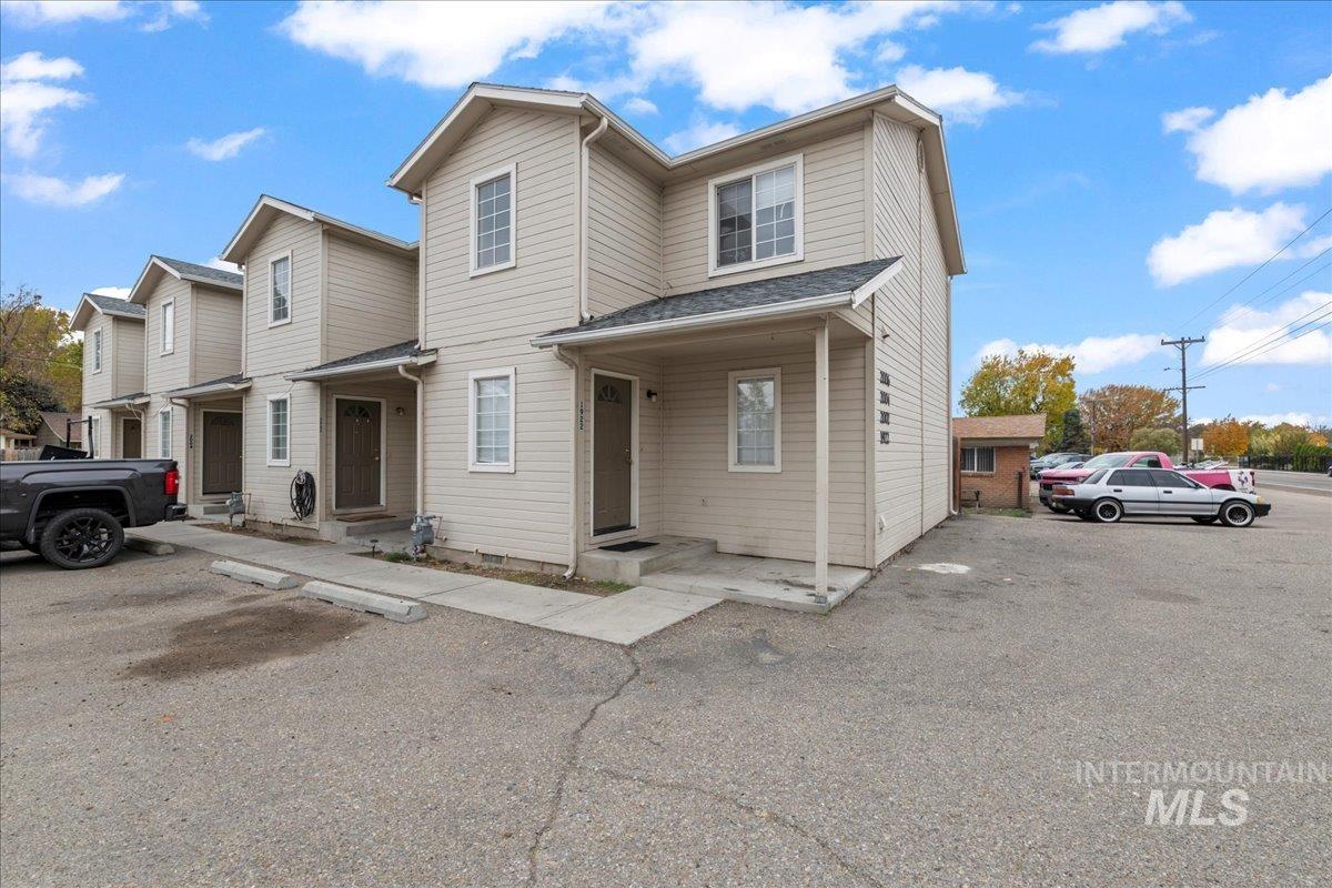 Traditional-style house featuring covered porch