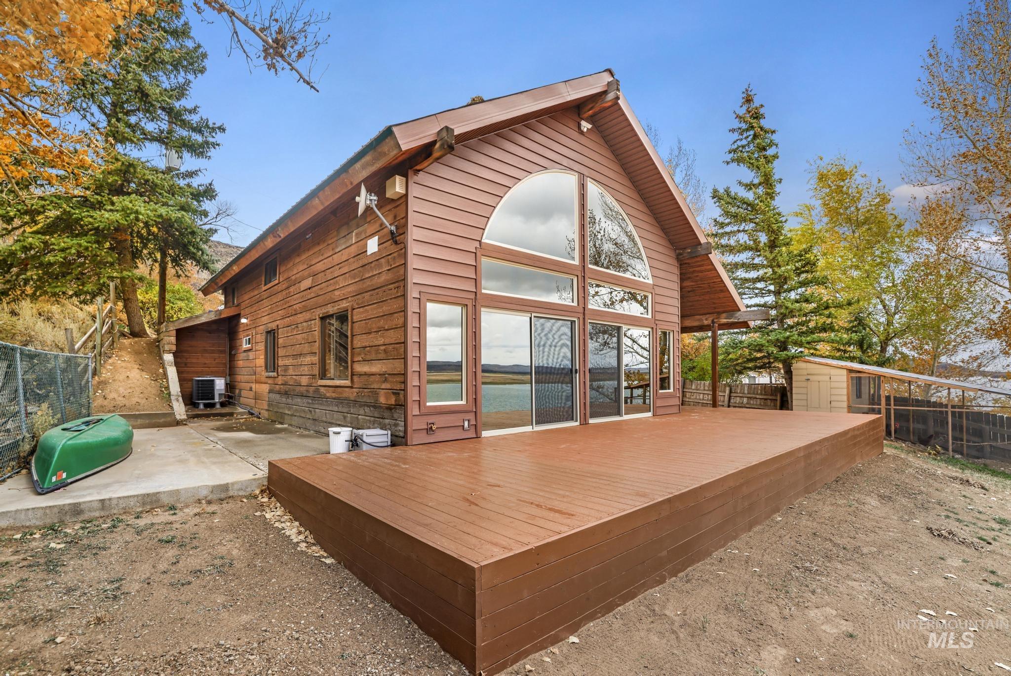 Rear view of house with a wooden deck