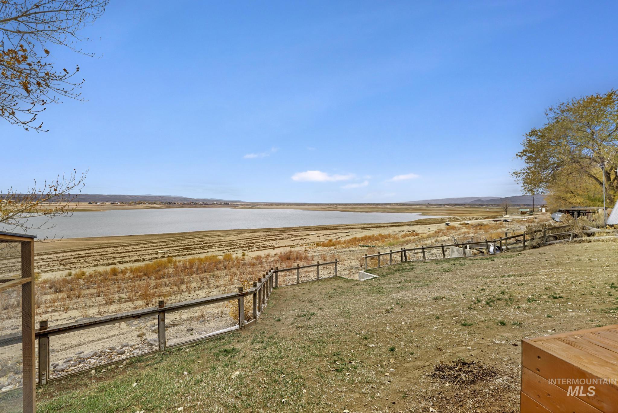 View of yard featuring a water view and a rural view