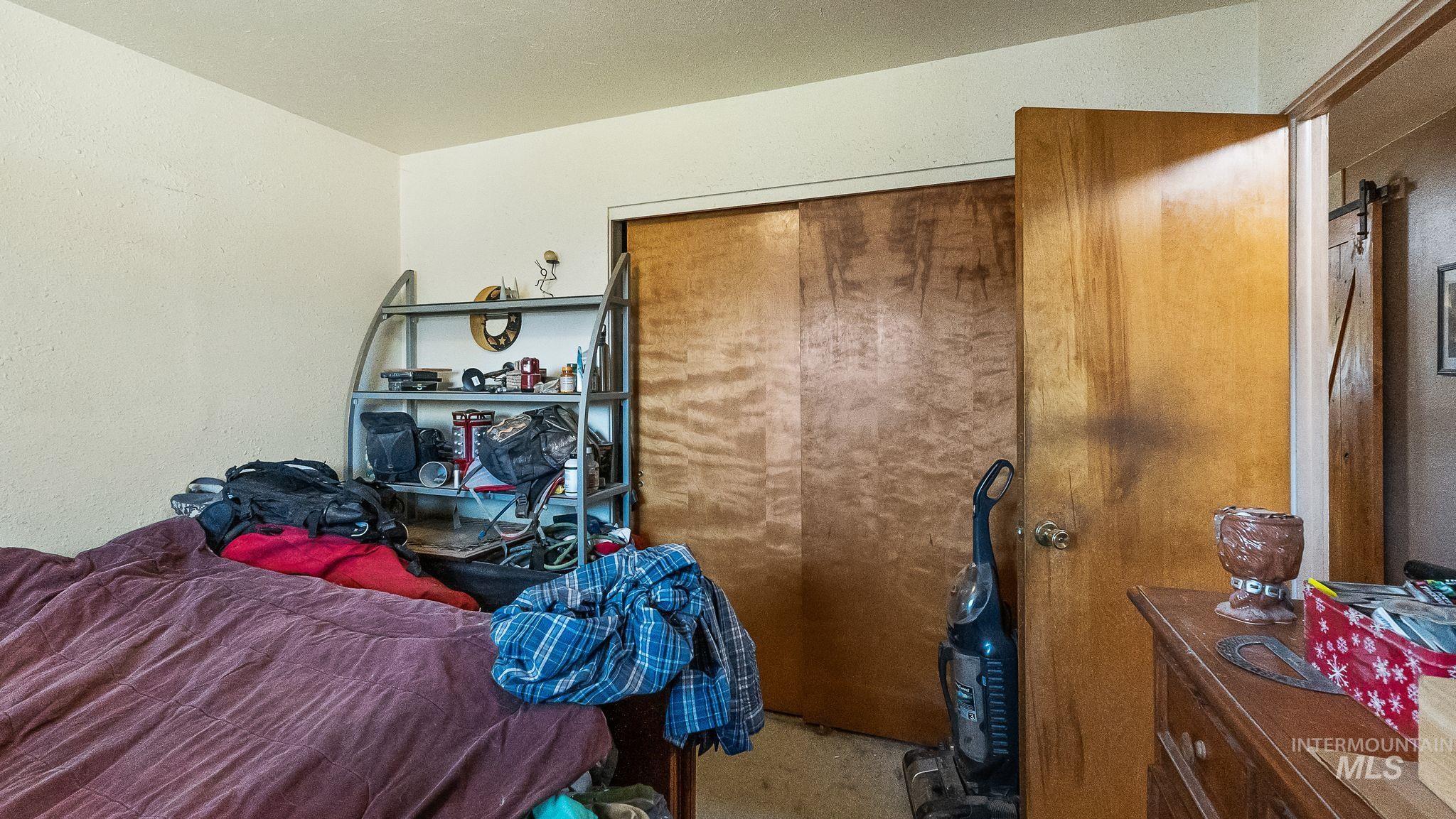 Bedroom with a closet and a barn door