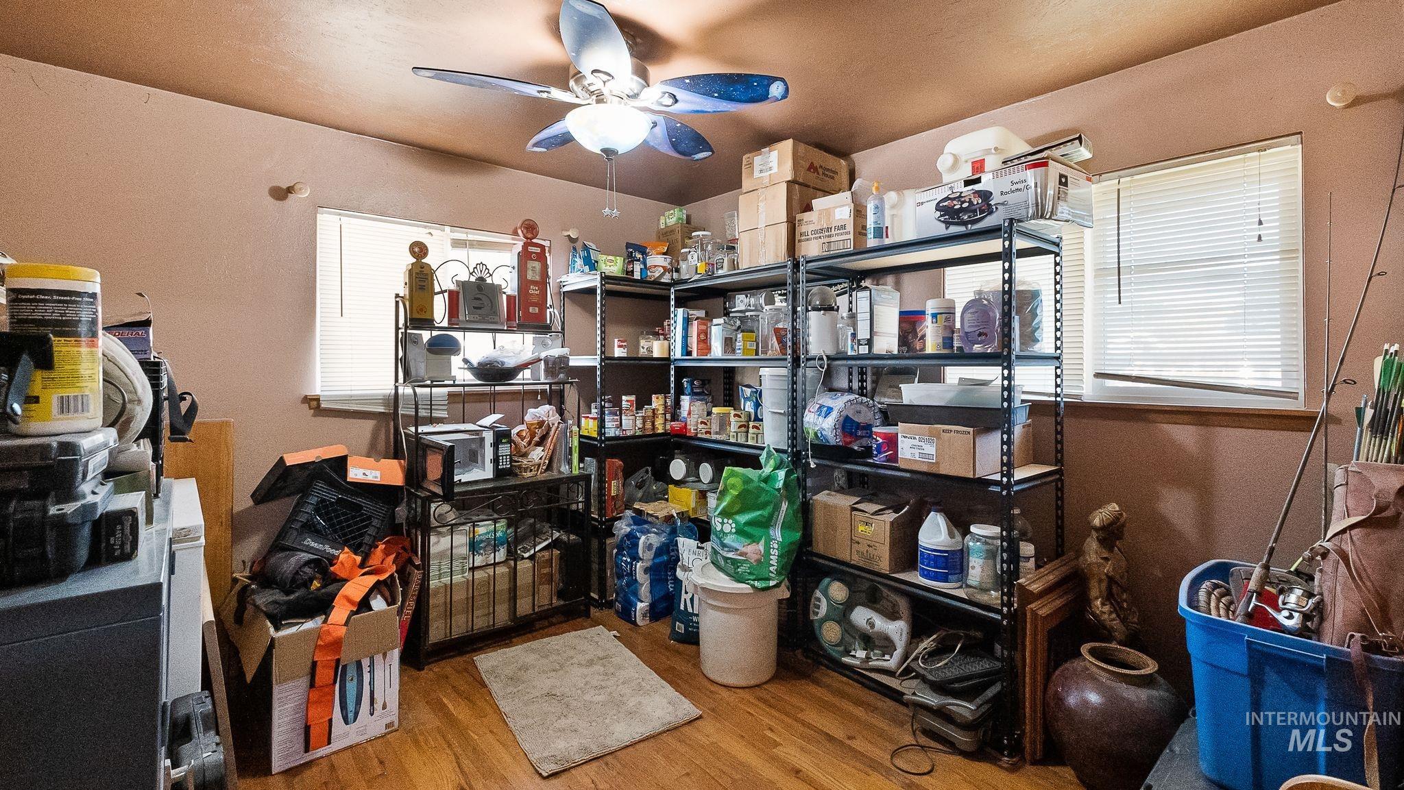 Storage room featuring a ceiling fan