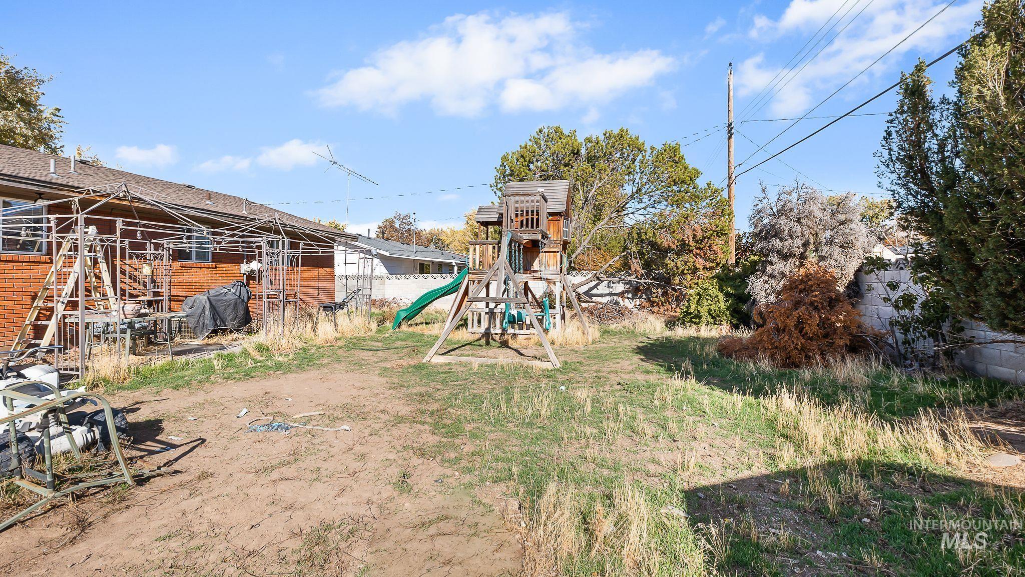 View of yard with a playground