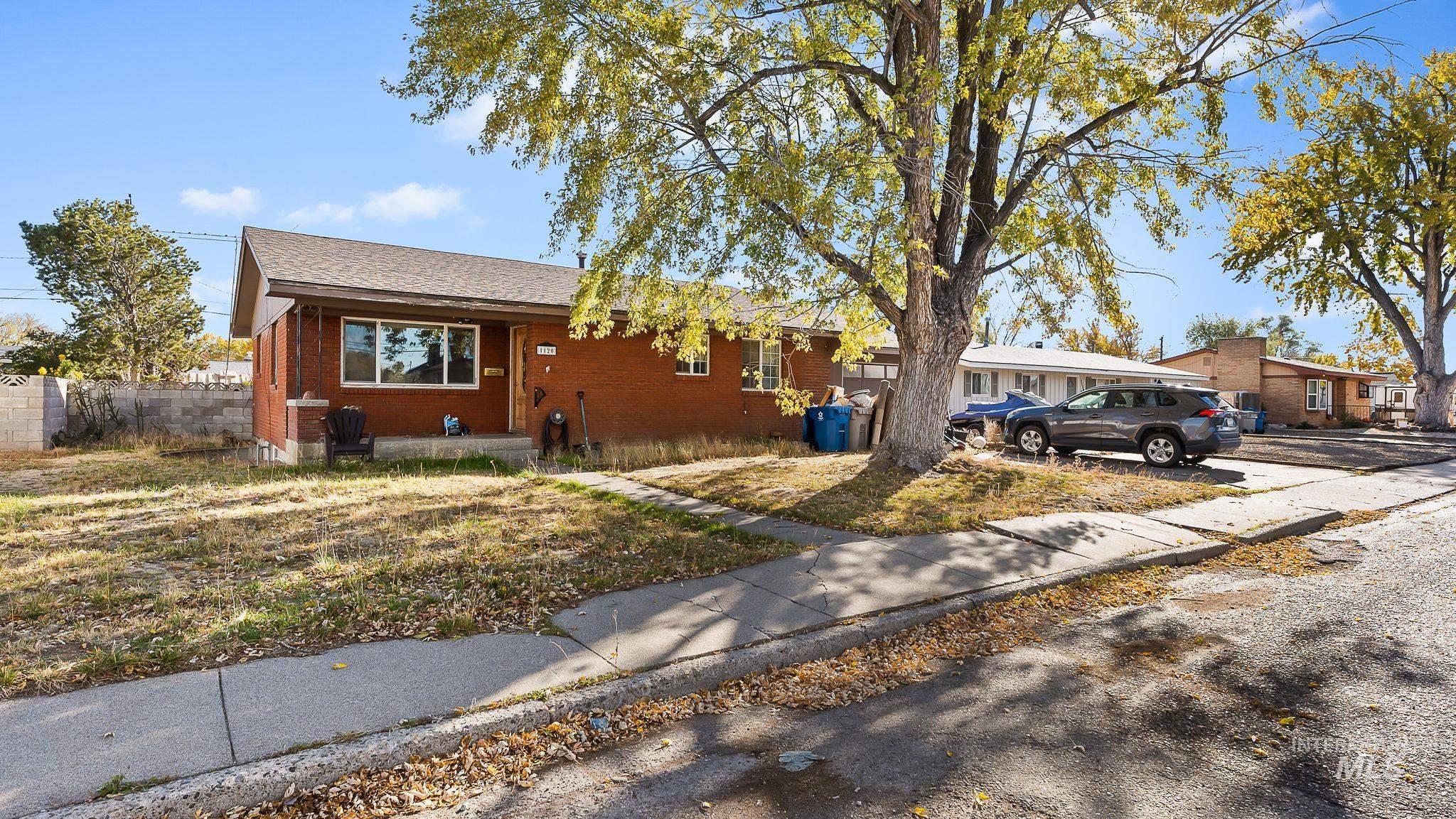 Ranch-style home featuring brick siding