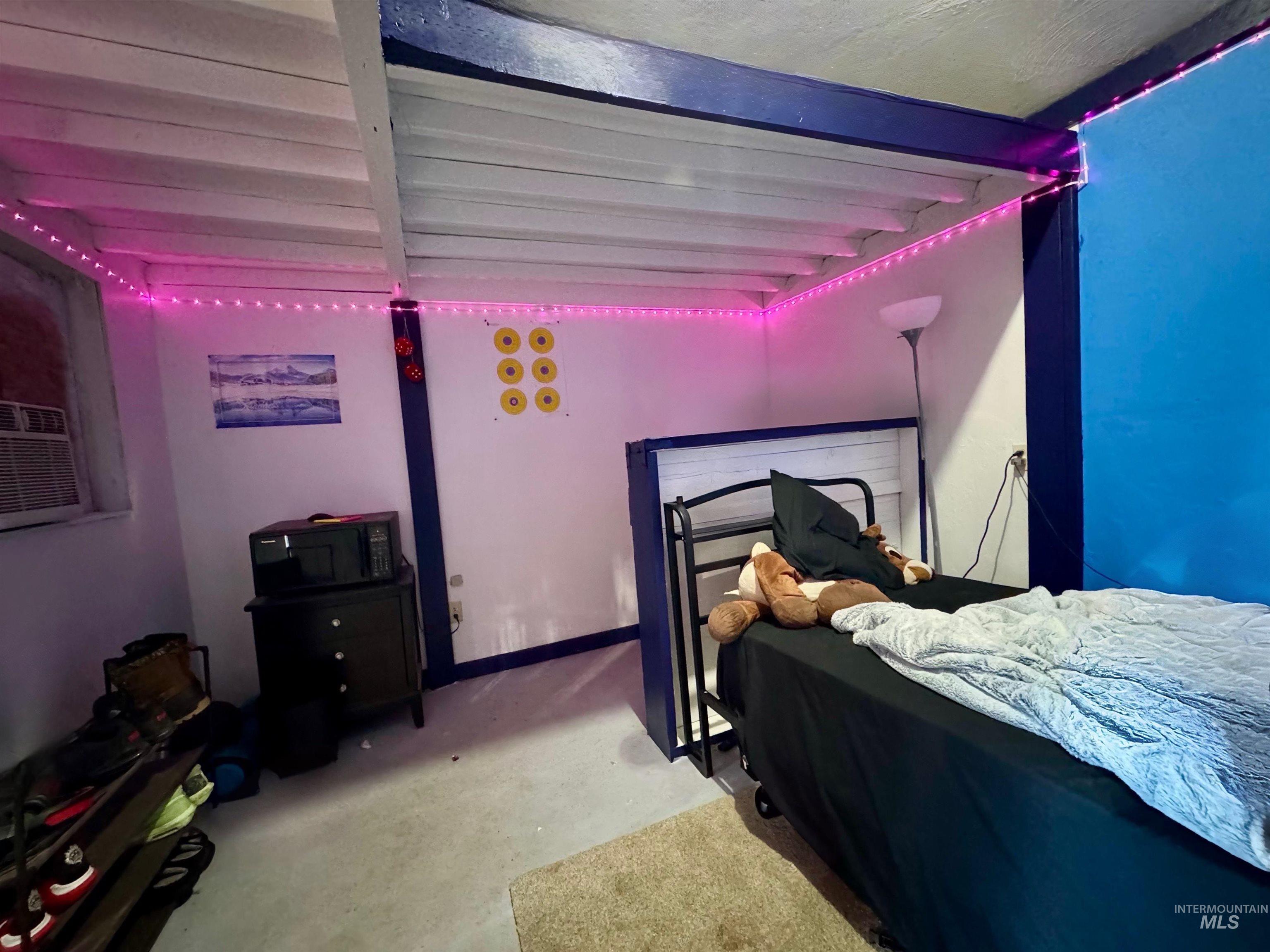 Bedroom with beamed ceiling