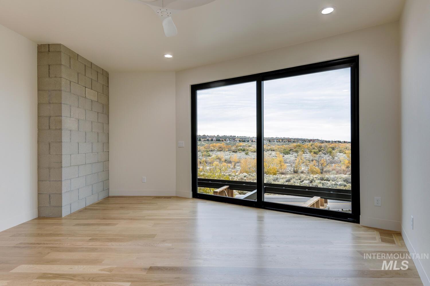 Spare room featuring light wood-style floors, recessed lighting, and a ceiling fan