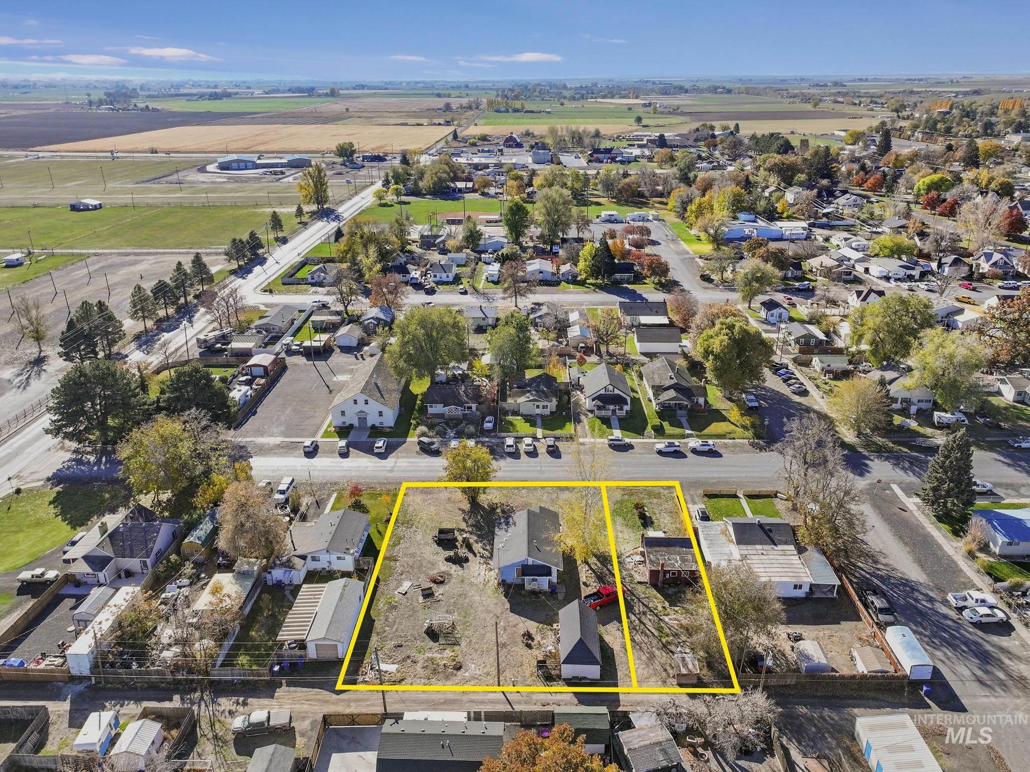 Aerial perspective of suburban area featuring property boundaries highlighted