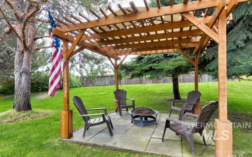 View of patio / terrace featuring a pergola and an outdoor fire pit
