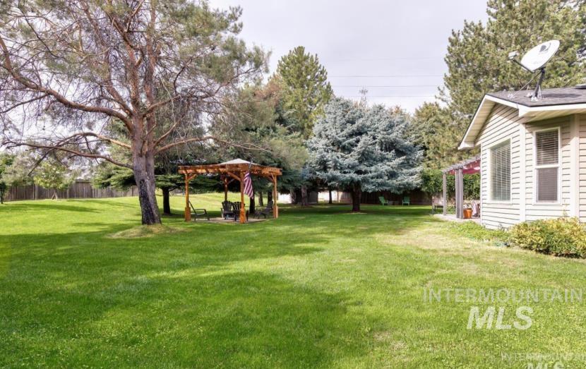 View of yard featuring a pergola and a patio