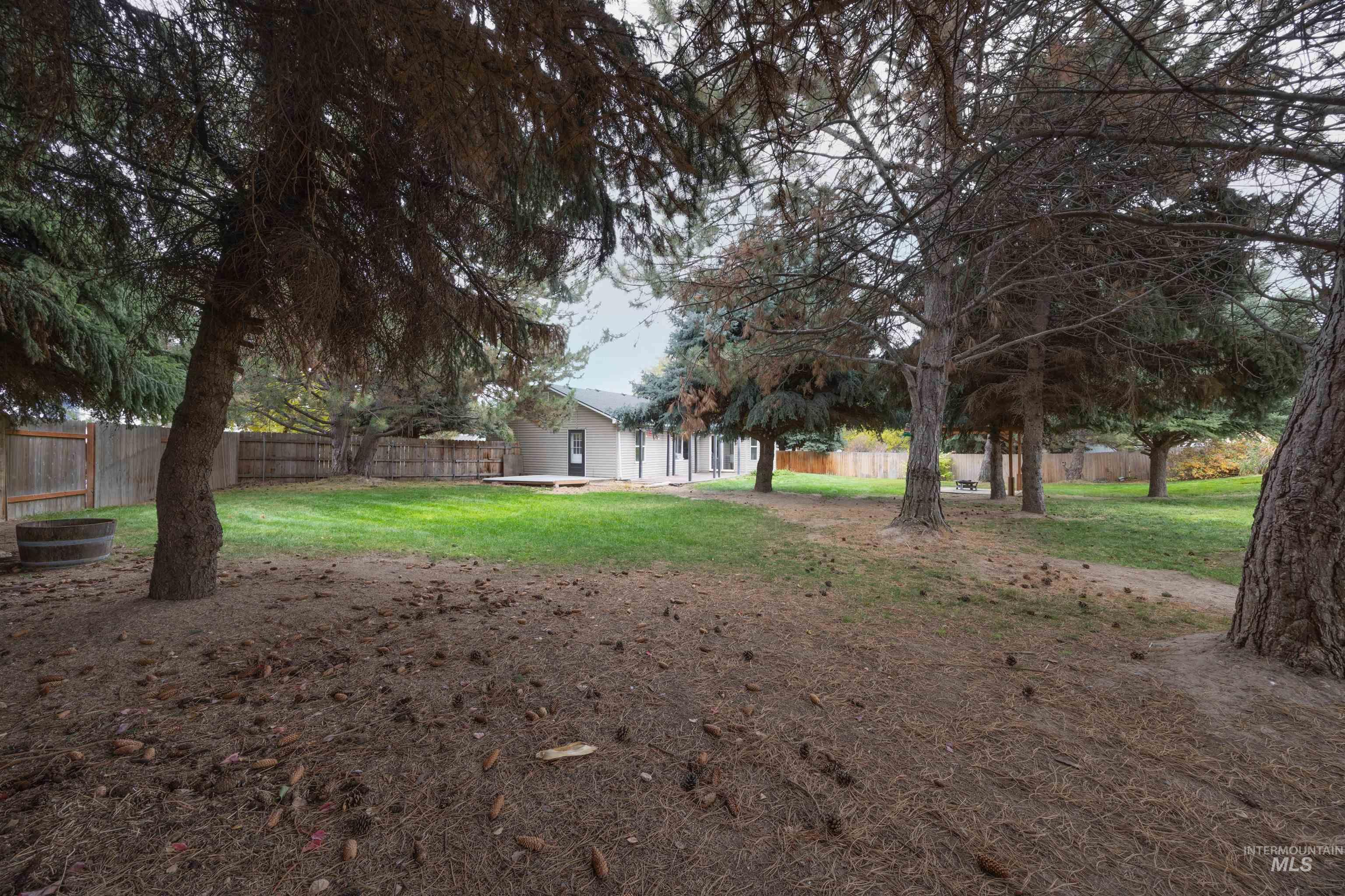 Fenced backyard with a patio area