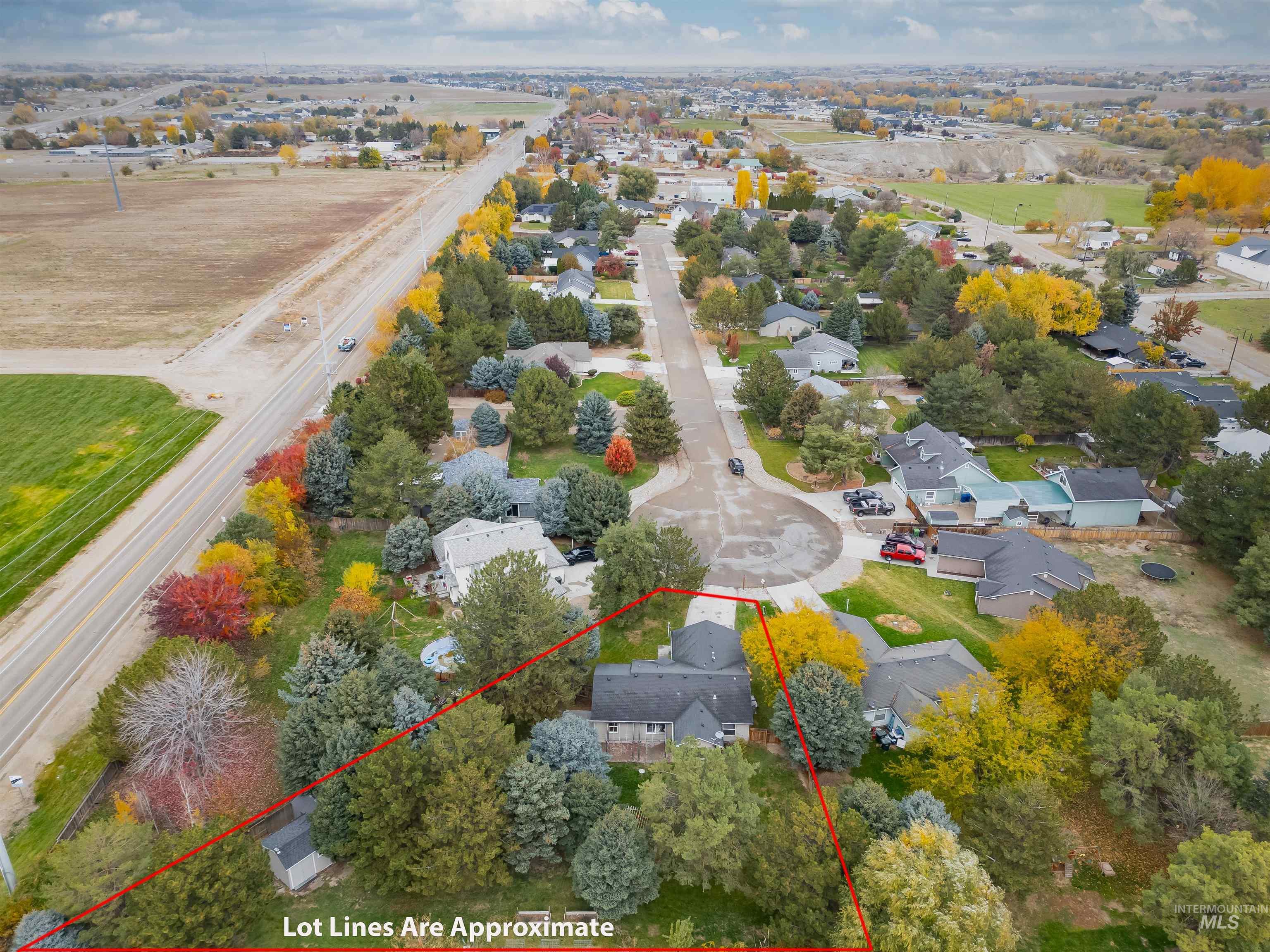 Aerial perspective of suburban area featuring property boundaries highlighted