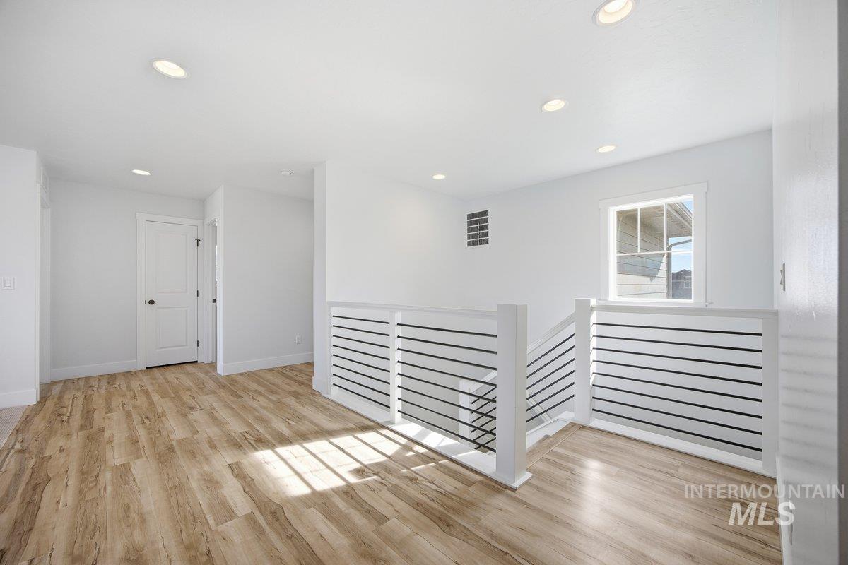 Spare room with recessed lighting and light wood-style floors