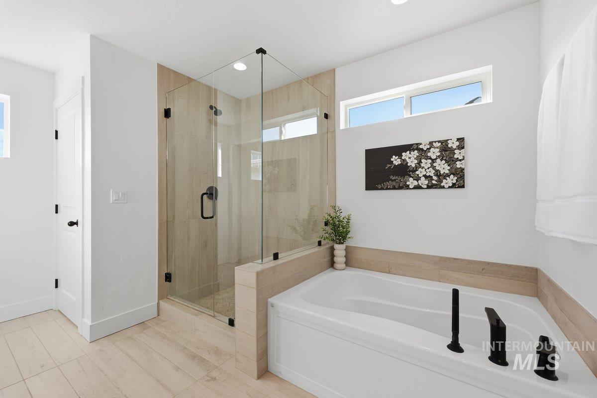 Full bathroom with a garden tub, a stall shower, and recessed lighting