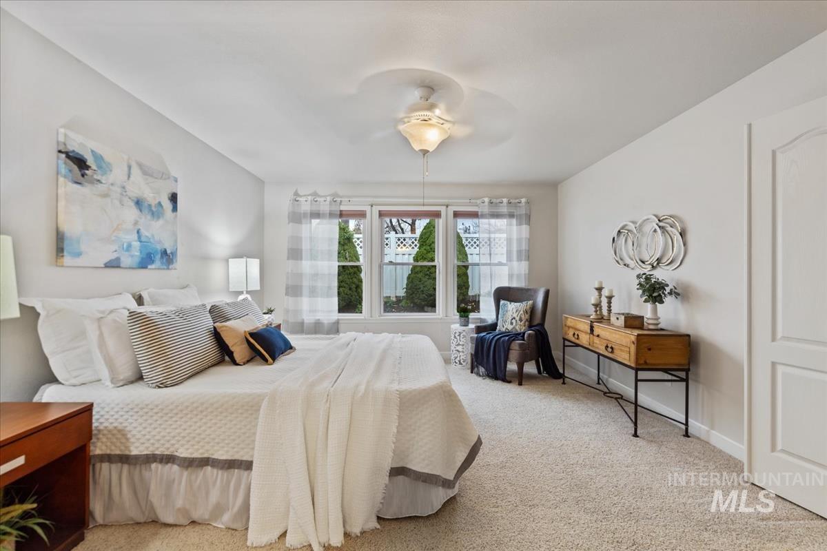 Bedroom featuring carpet and a ceiling fan