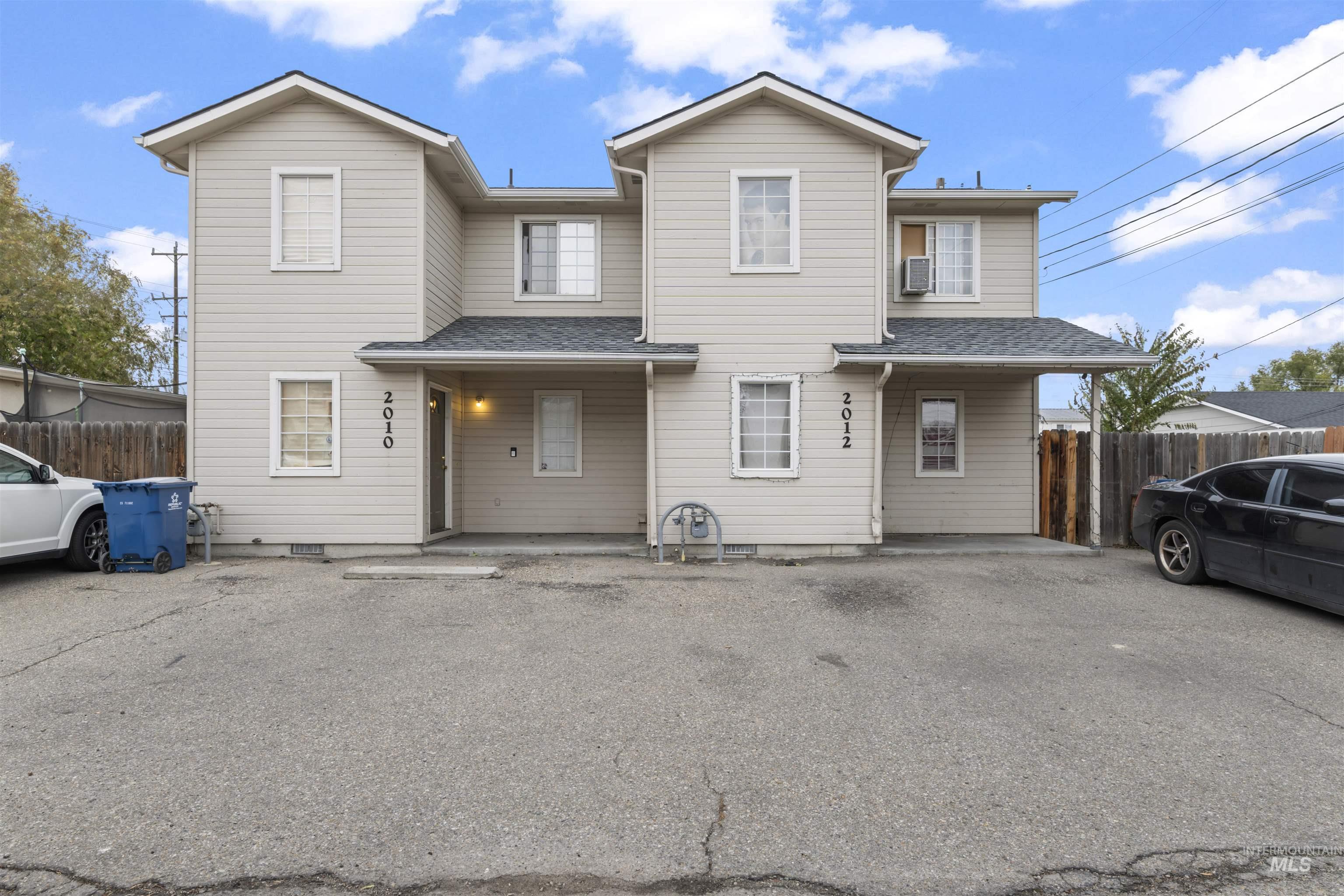 Traditional-style house with roof with shingles and a porch