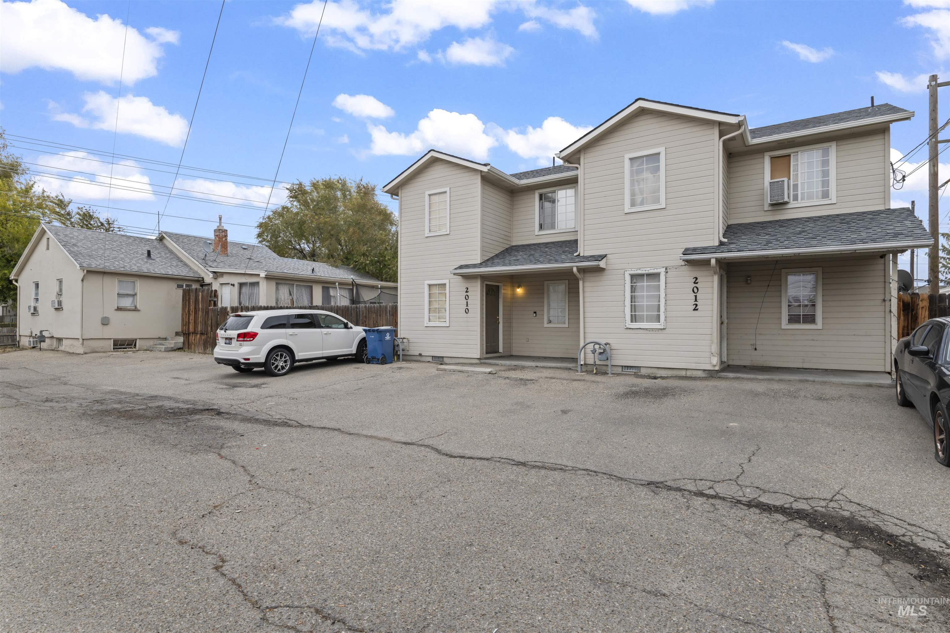 Traditional-style house with roof with shingles