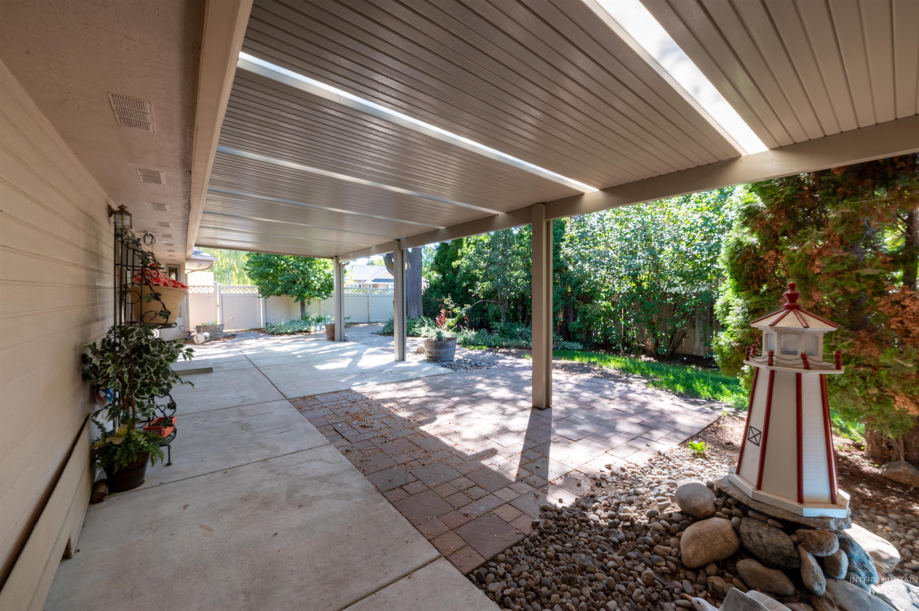 Fenced backyard with a patio