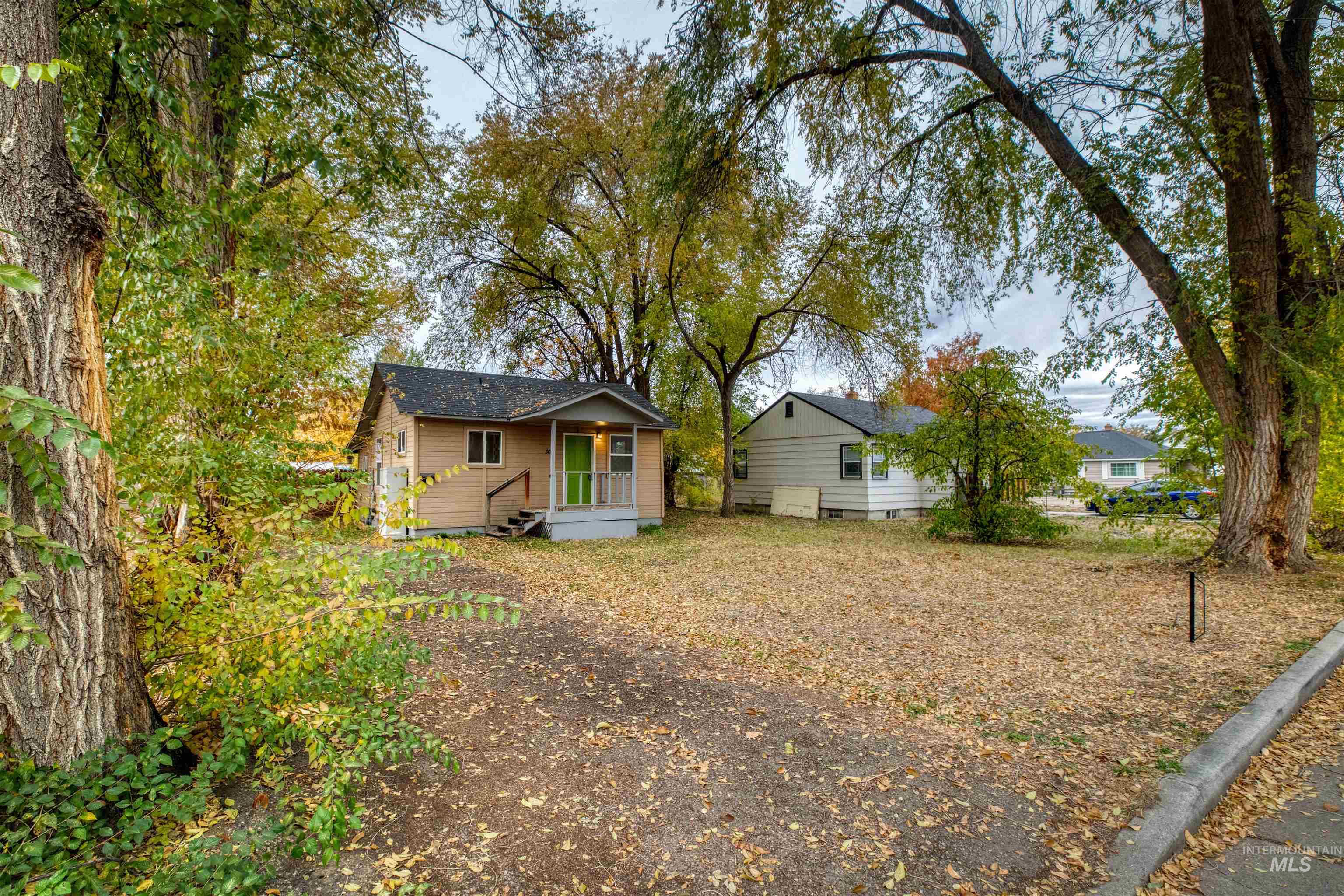 Rear view of property featuring crawl space and covered porch