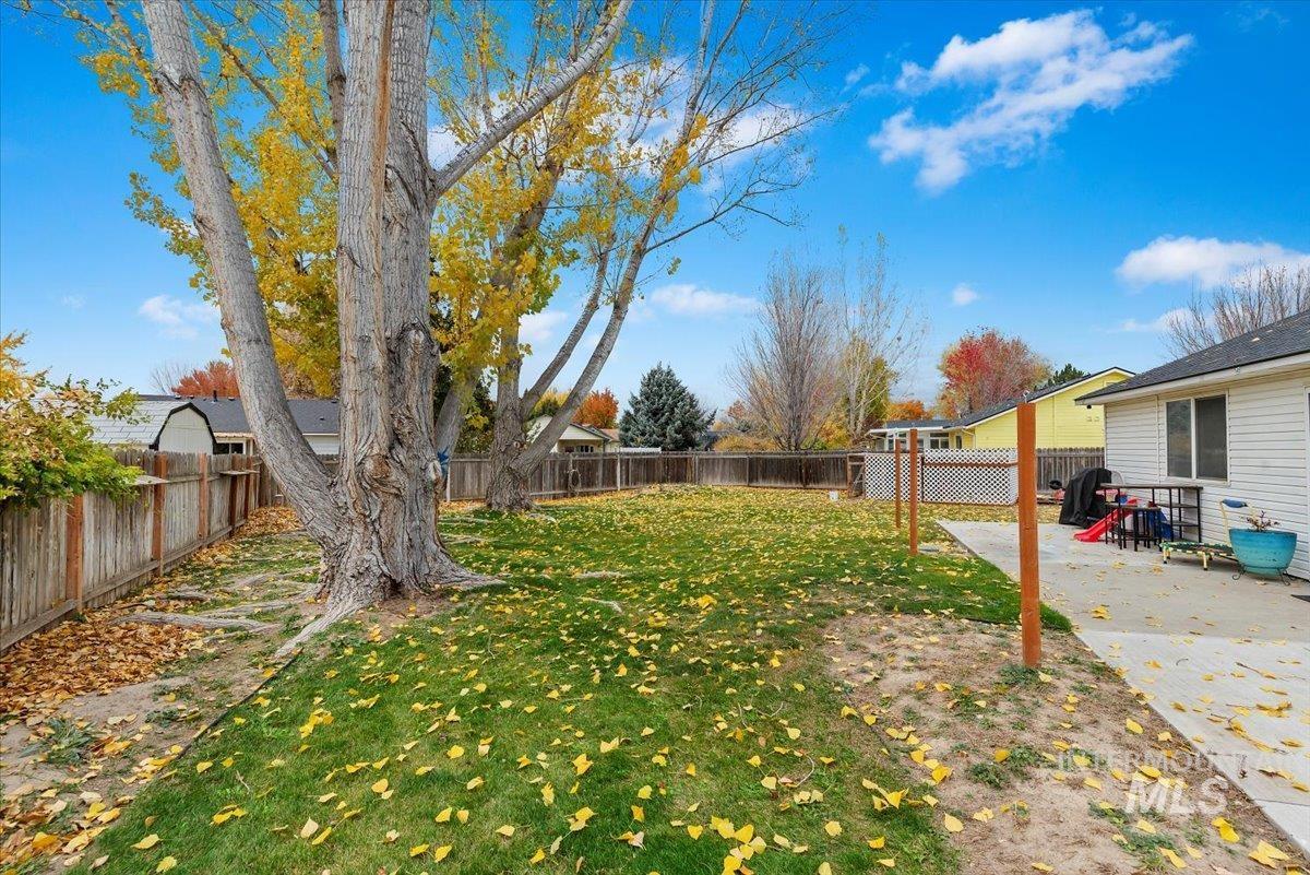 Fenced backyard with a patio