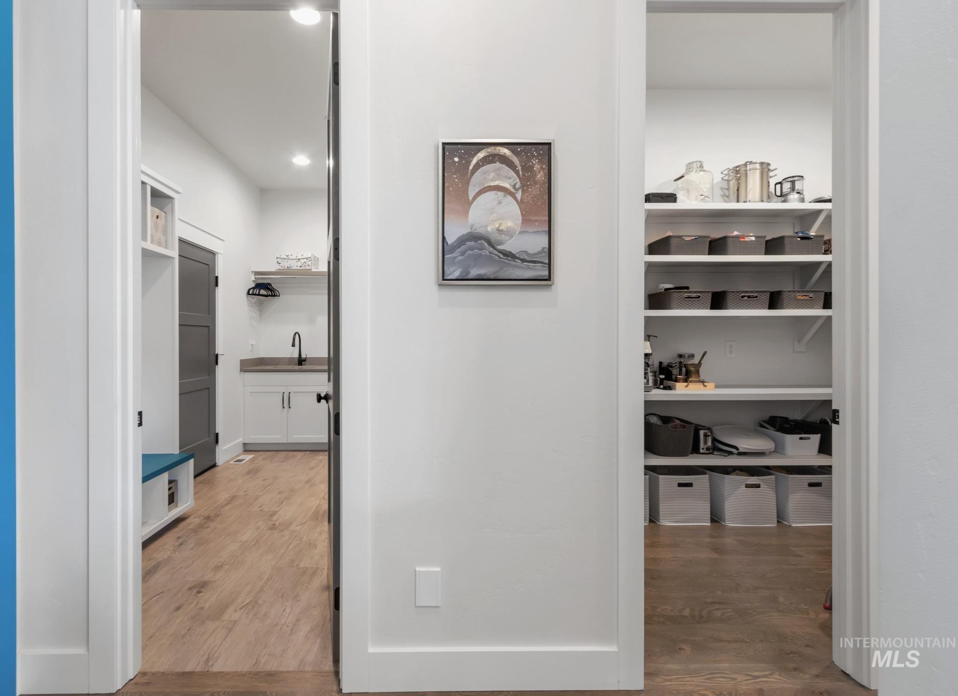 Hallway with light wood-style flooring