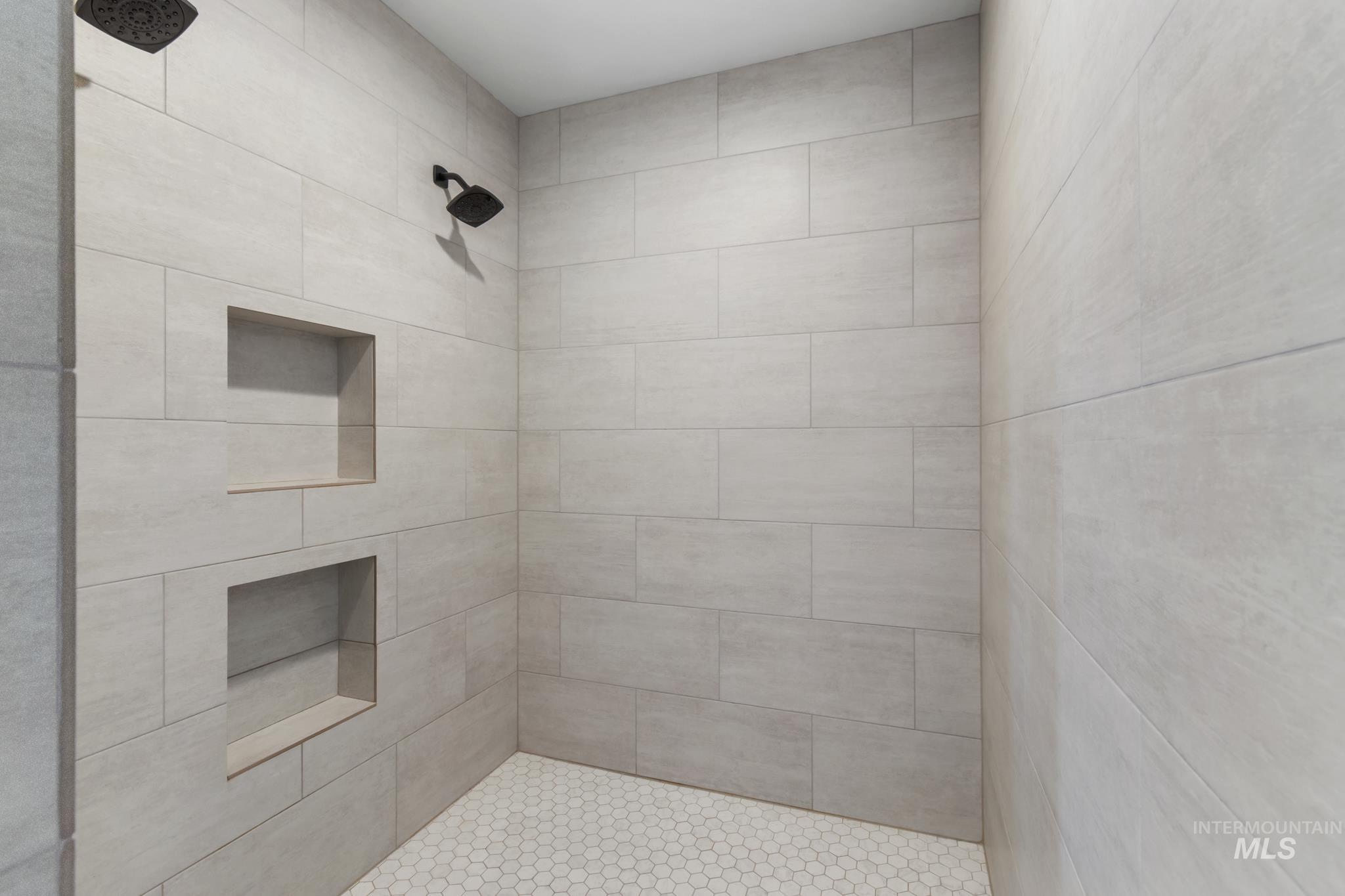 Full bathroom with a tile shower