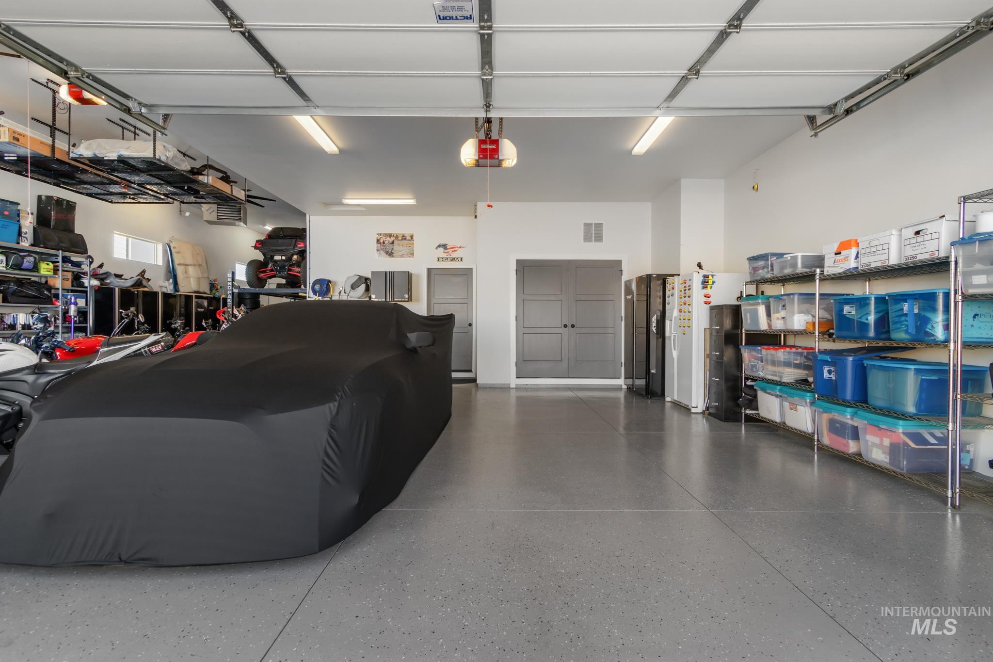 Garage featuring a garage door opener