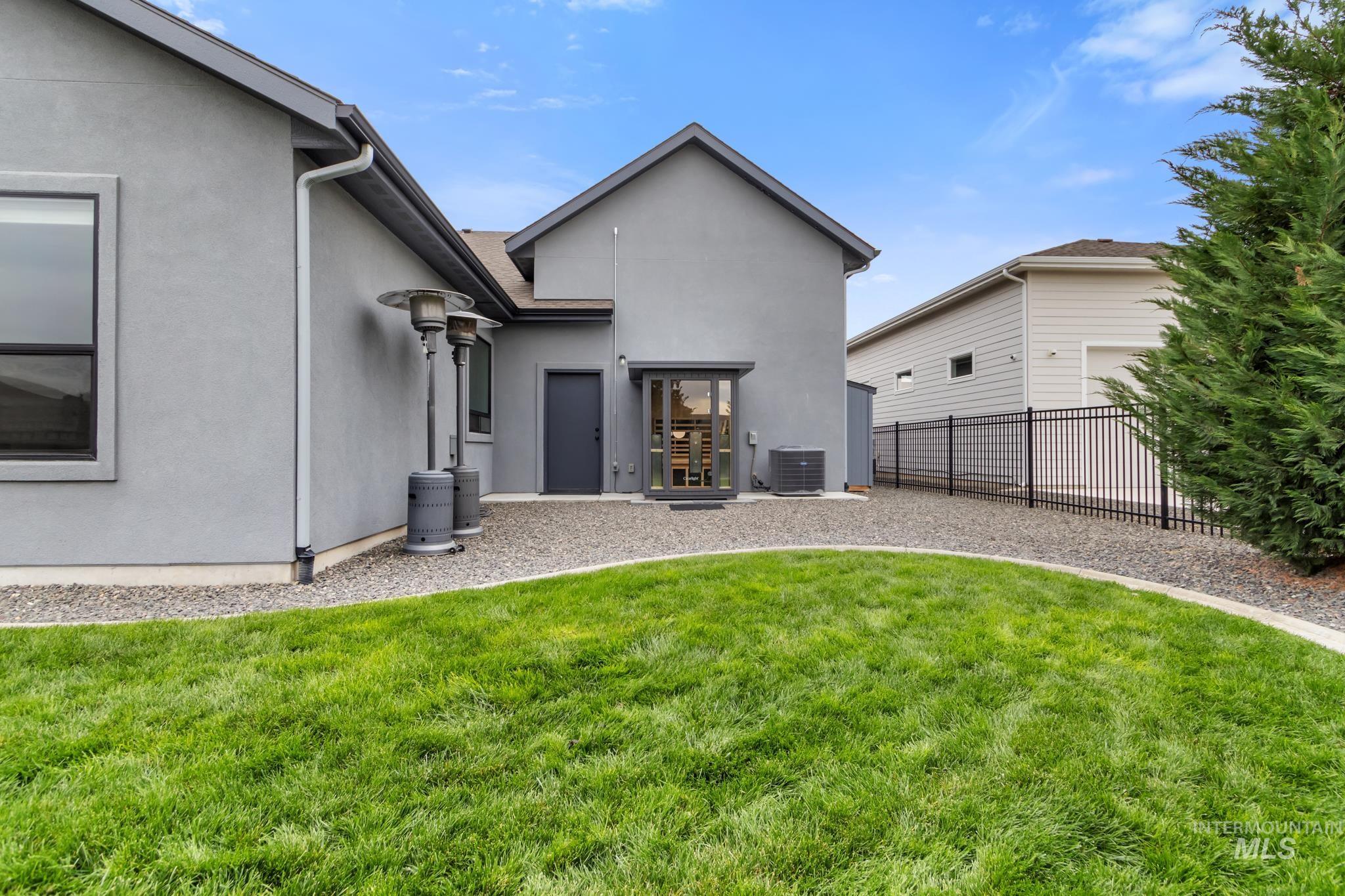 Rear view of property featuring stucco siding