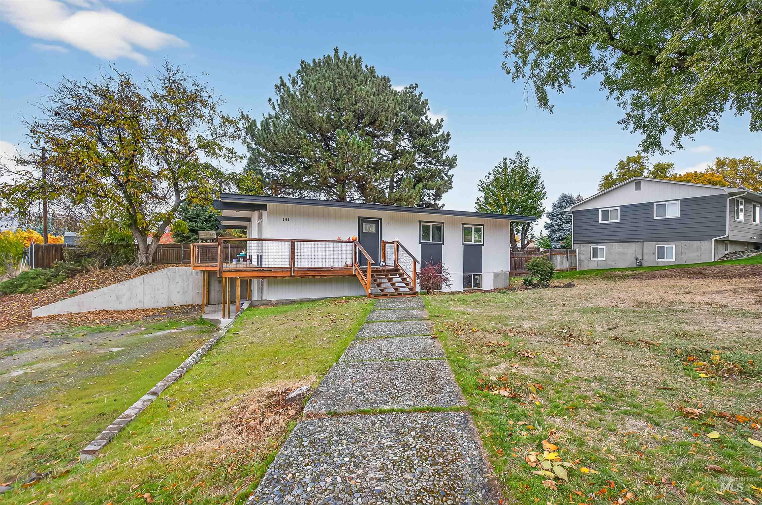 Rear view of house with a deck