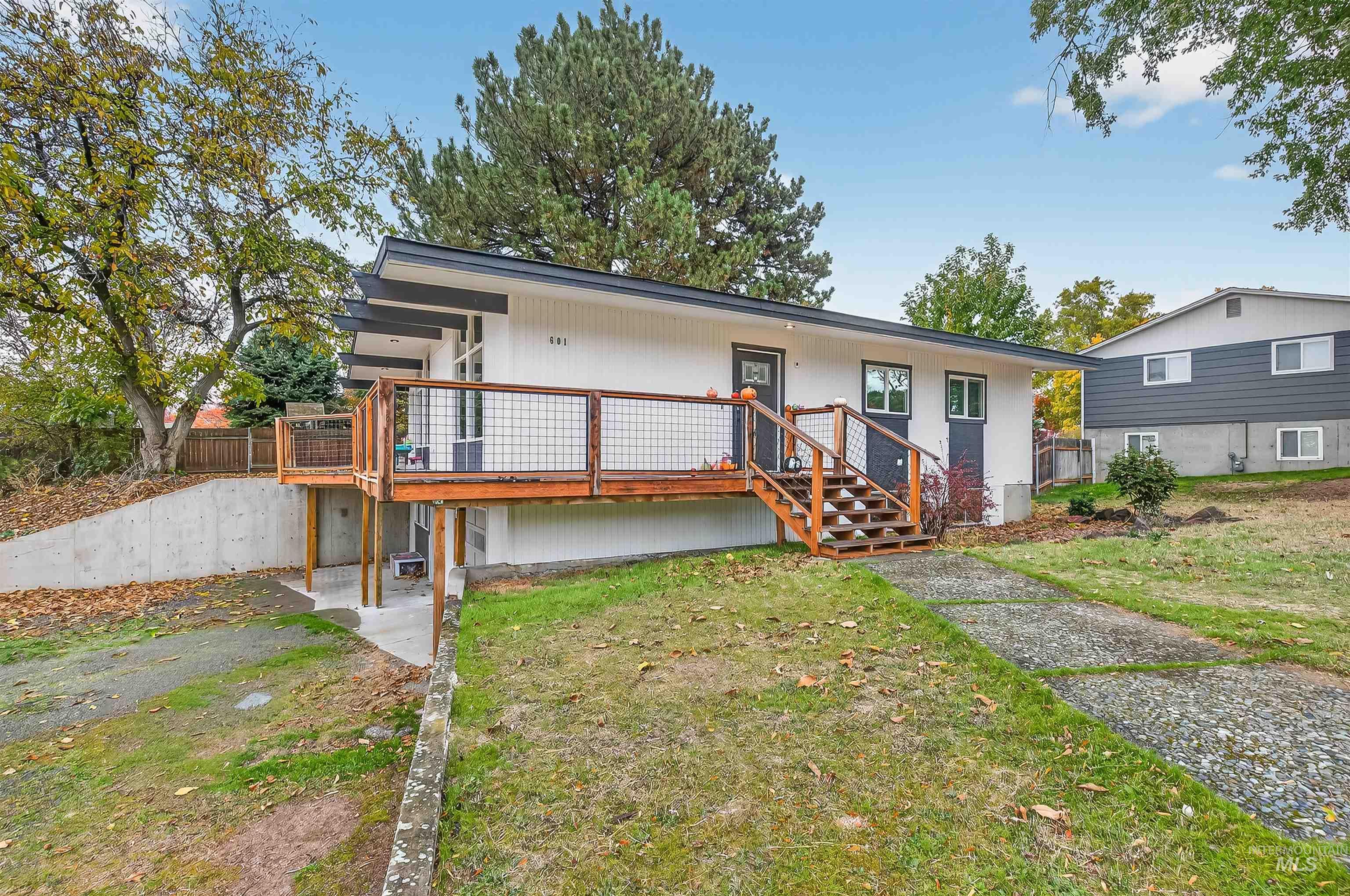 Rear view of house featuring a deck