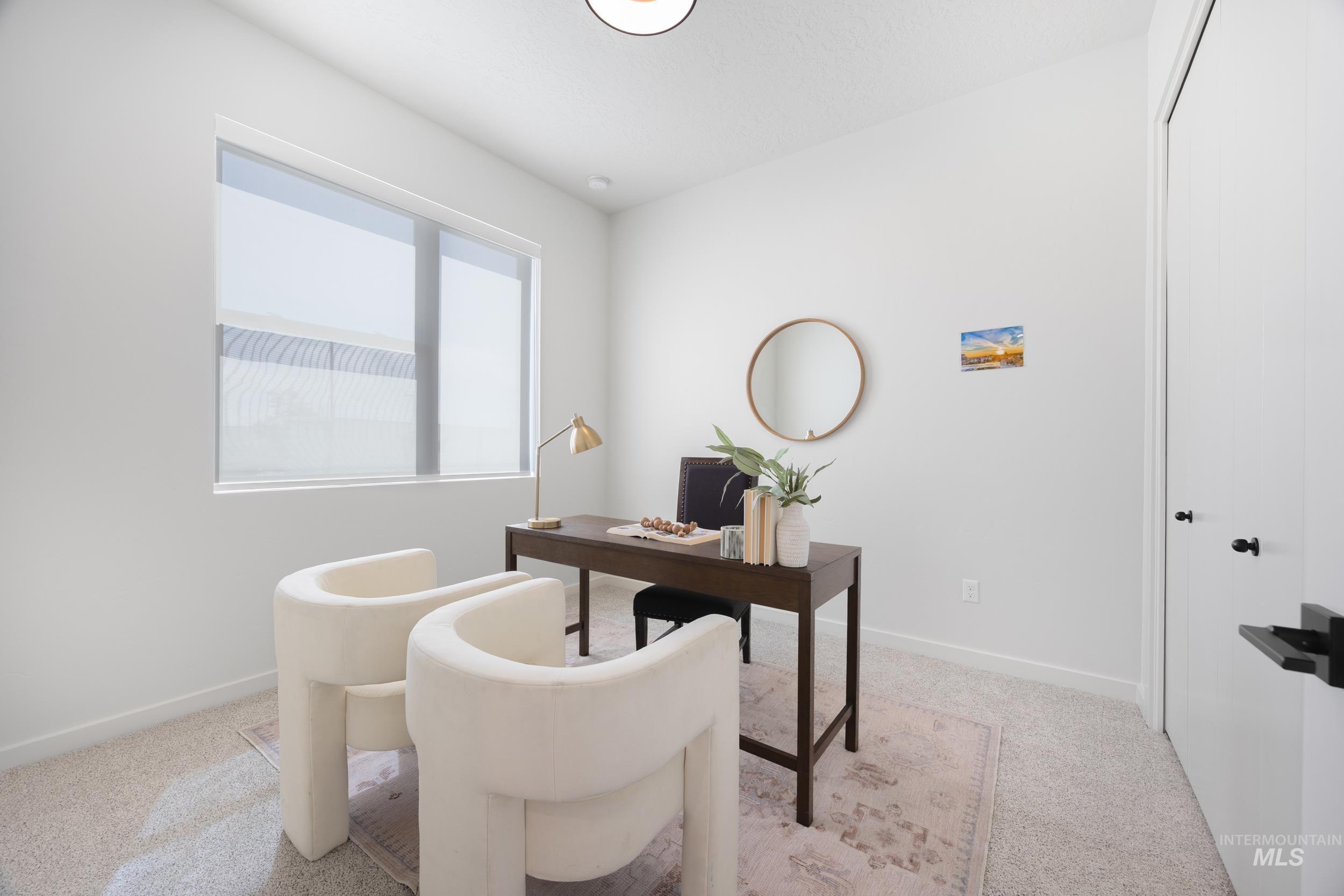 Office area with light colored carpet