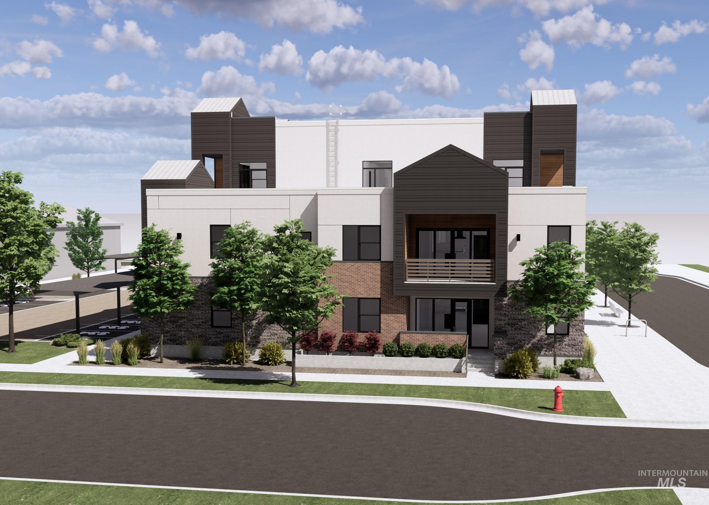View of front of house with stucco siding and a balcony