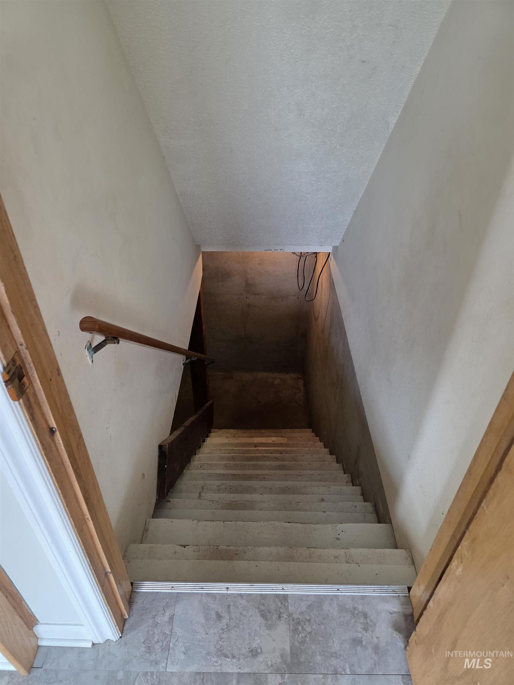 Staircase with a textured ceiling