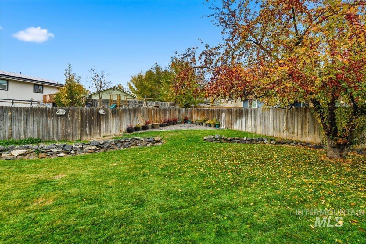 View of fenced backyard