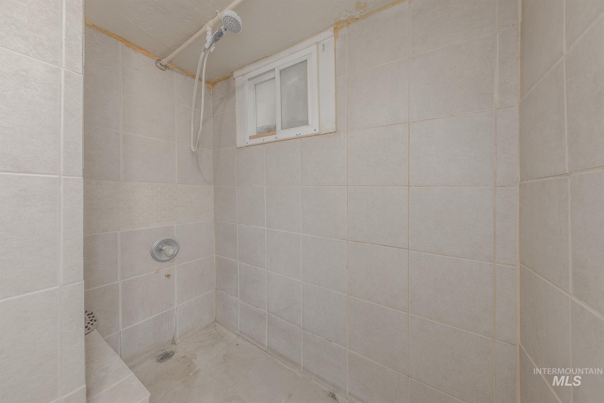 Bathroom with tiled shower
