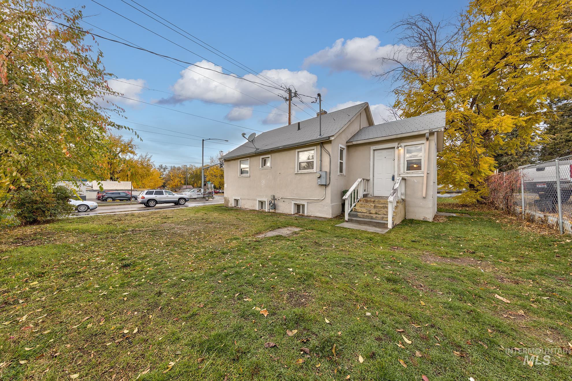 Rear view of house with stucco siding